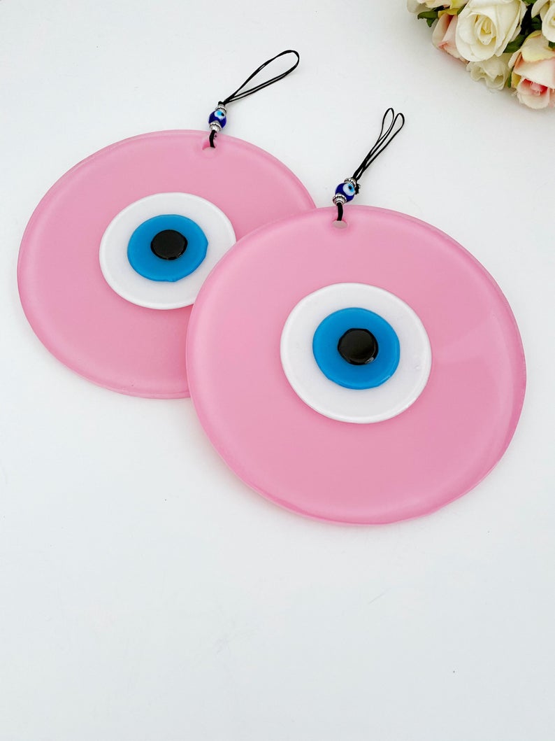 Handmade Pink Evil Eye Wall Decor featuring unique glass beads, perfect for baby room and Turkish decor.