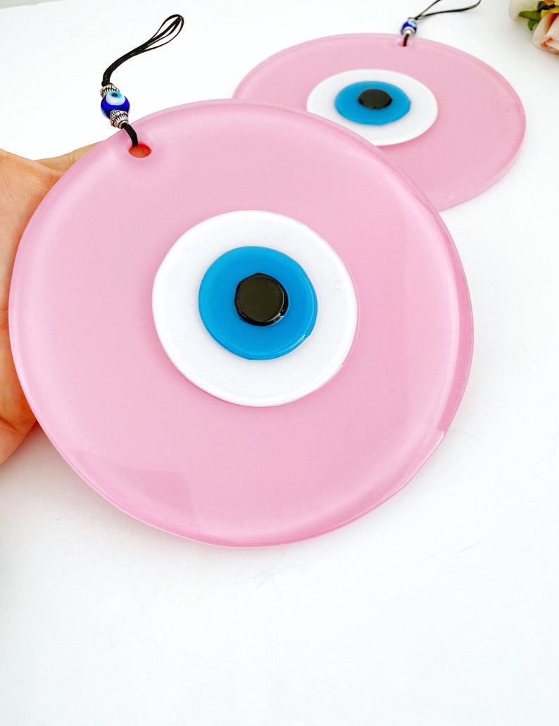 Handmade Pink Evil Eye Wall Decor featuring unique glass beads, perfect for baby room and Turkish decor.
