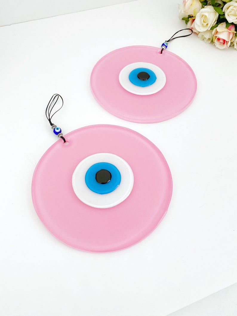 Handmade Pink Evil Eye Wall Decor featuring unique glass beads, perfect for baby room and Turkish decor.