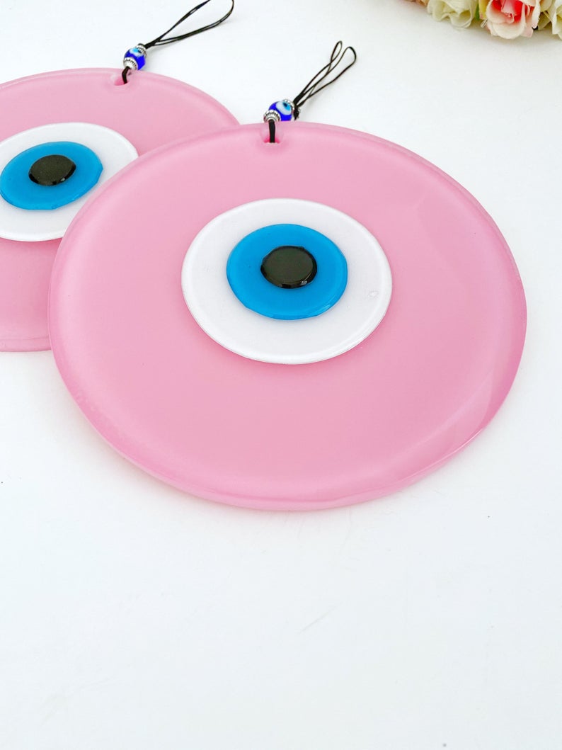 Handmade Pink Evil Eye Wall Decor featuring unique glass beads, perfect for baby room and Turkish decor.