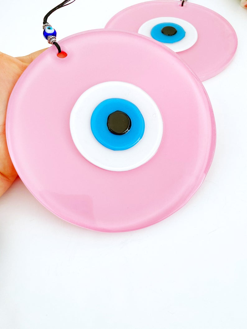 Handmade Pink Evil Eye Wall Decor featuring unique glass beads, perfect for baby room and Turkish decor.