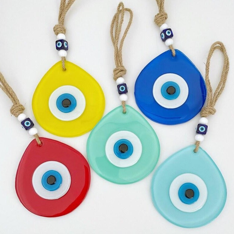 Colorful Evil Eye Wall Hanging made of handmade fused glass, featuring a teardrop design and vibrant colors, symbolizing protection and luck.
