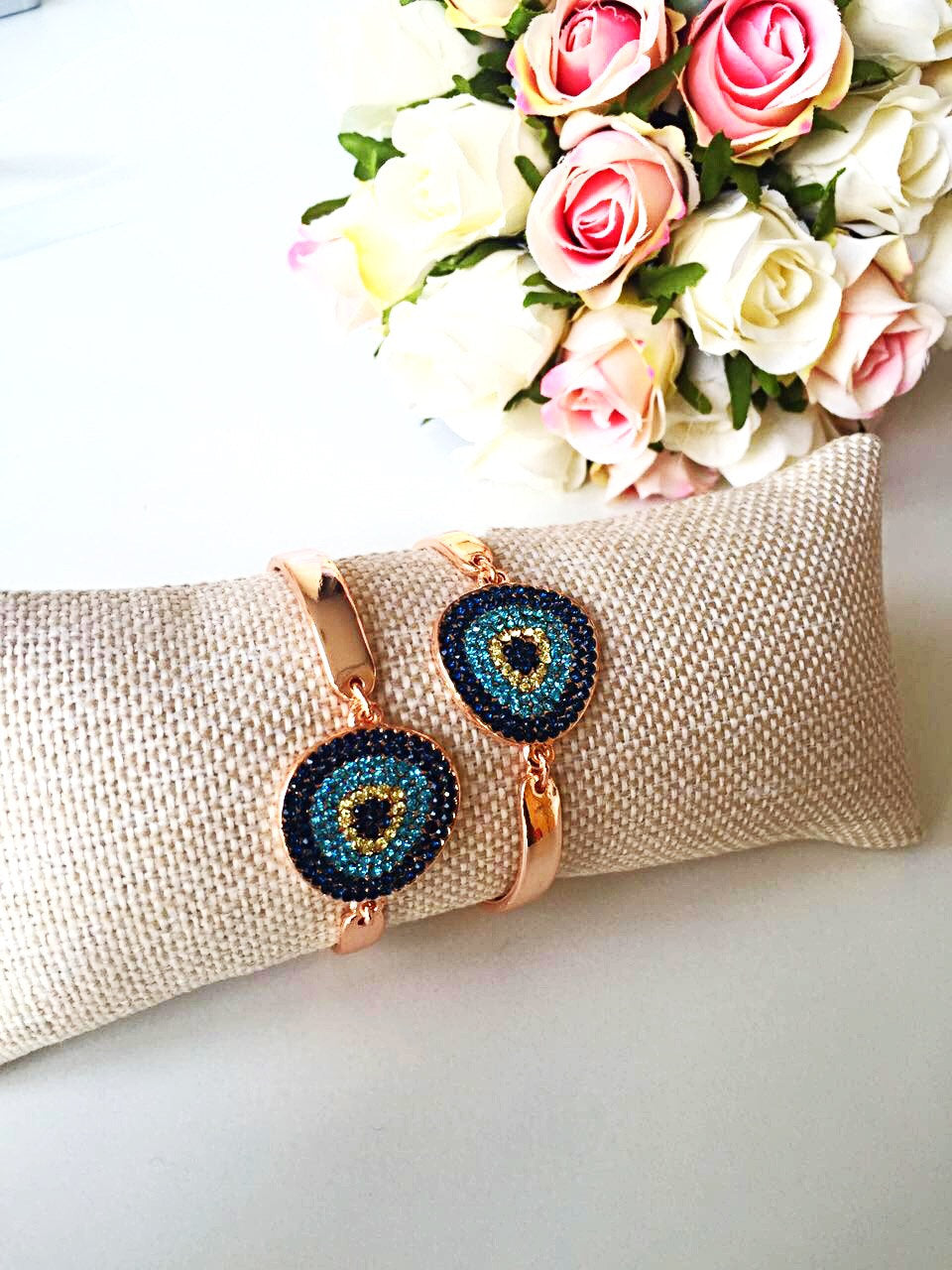 Handmade Evil Eye Zircon Bracelet featuring a rose gold chain and sparkling zirconia stones, symbolizing protection and good luck.