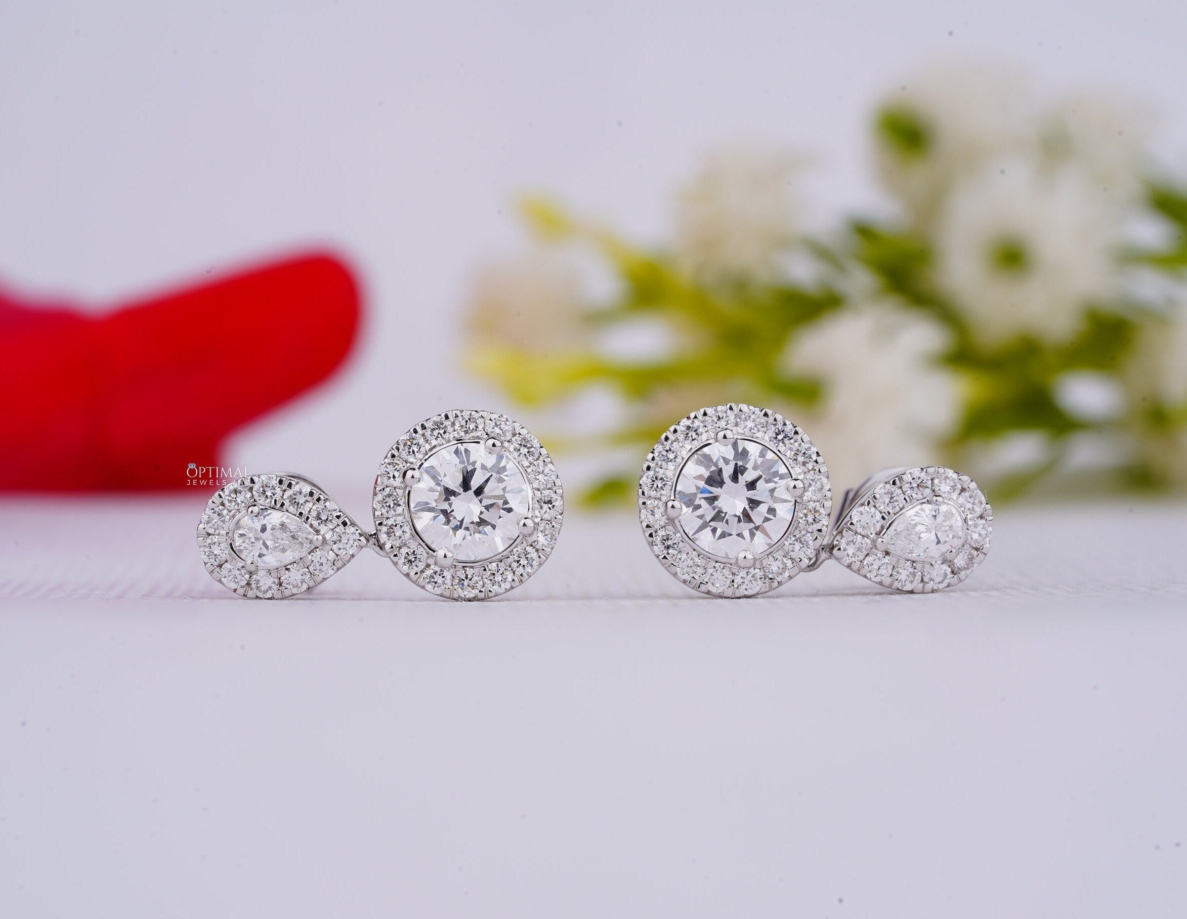 Exquisite Double Halo Drop Earrings featuring 4.00 Ct brilliant round cut and teardrop lab diamonds, elegantly designed for special occasions.