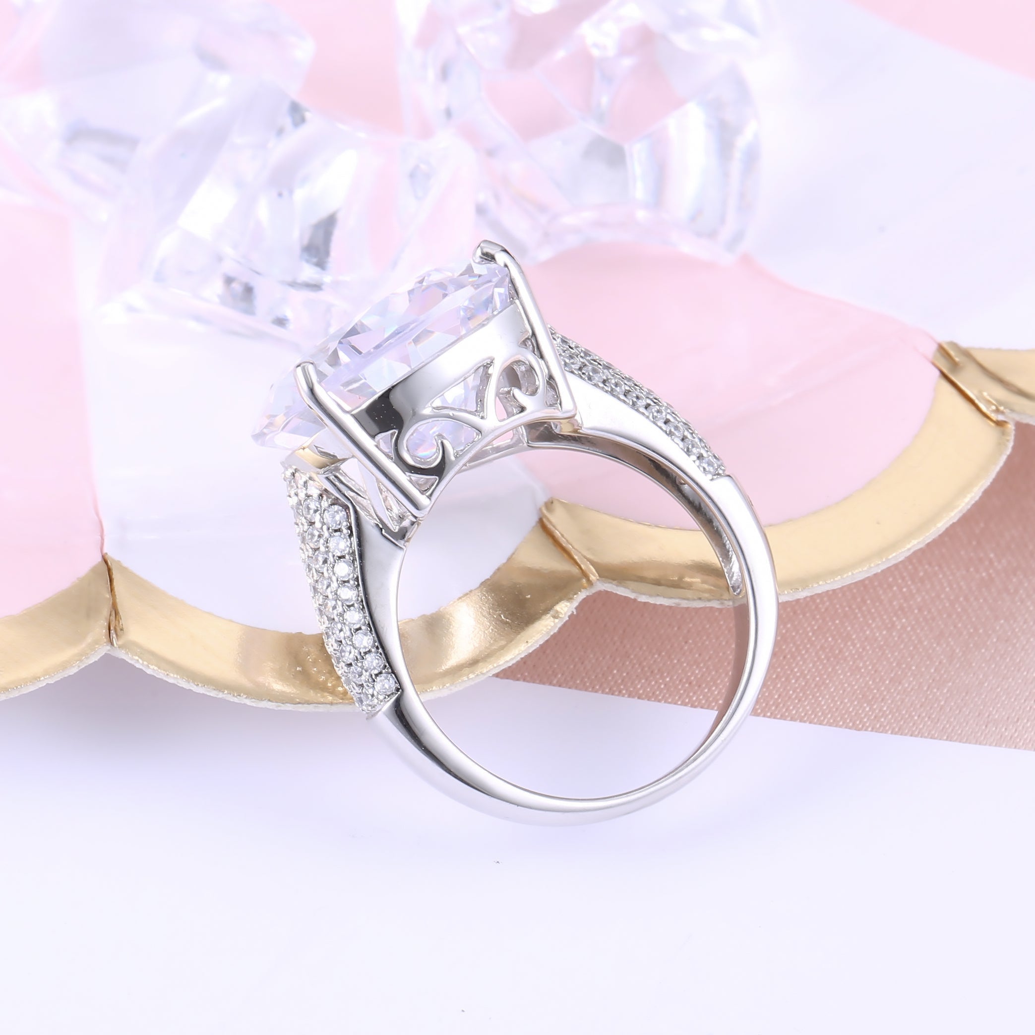 An extraordinary white sapphire engagement ring featuring a pear-shaped stone set in 925 sterling silver with a real white gold finish.