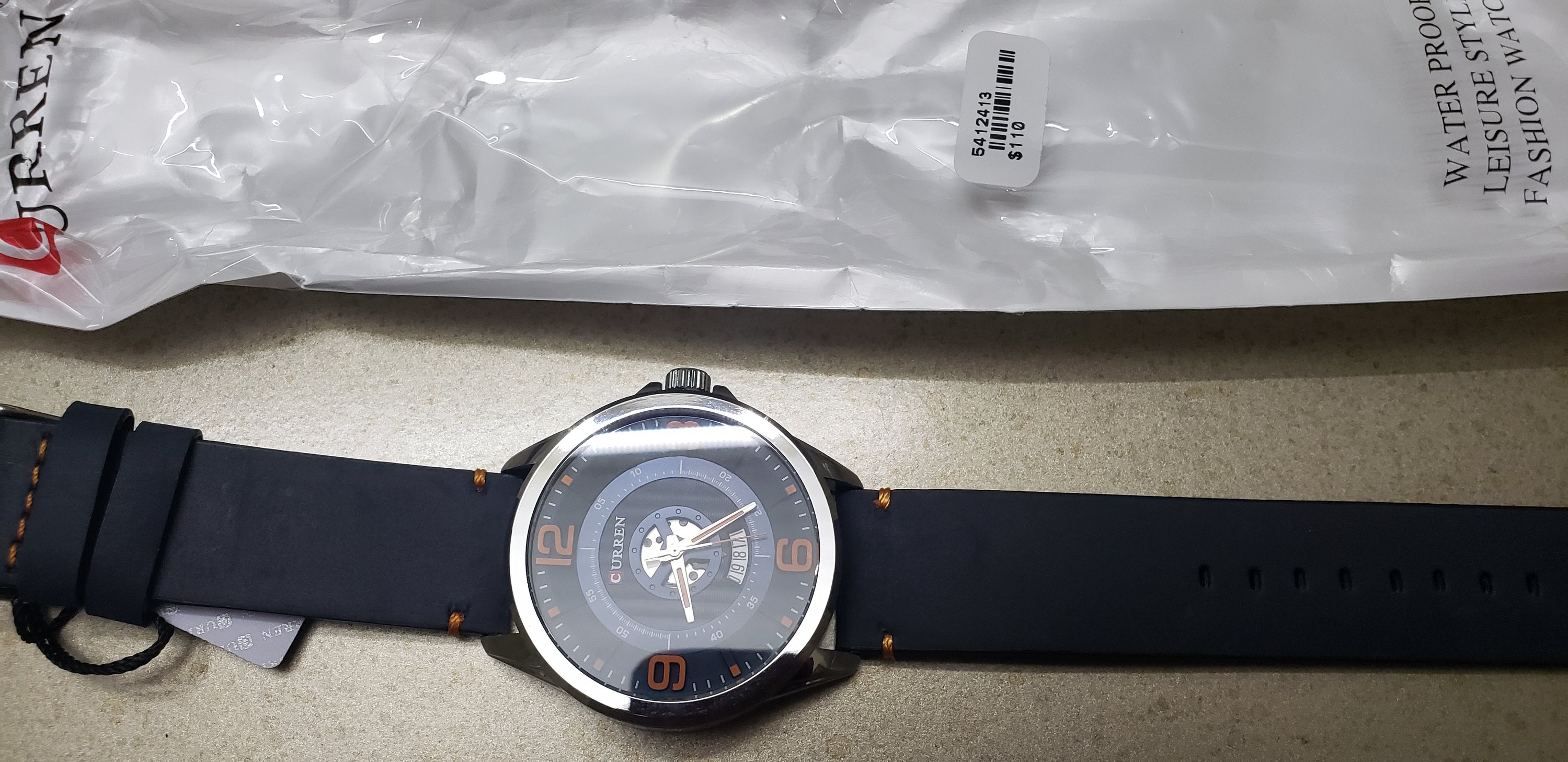 EXULTANT CLASSIC LEATHER watch featuring a sleek design with a natural leather strap and a steel back cover.