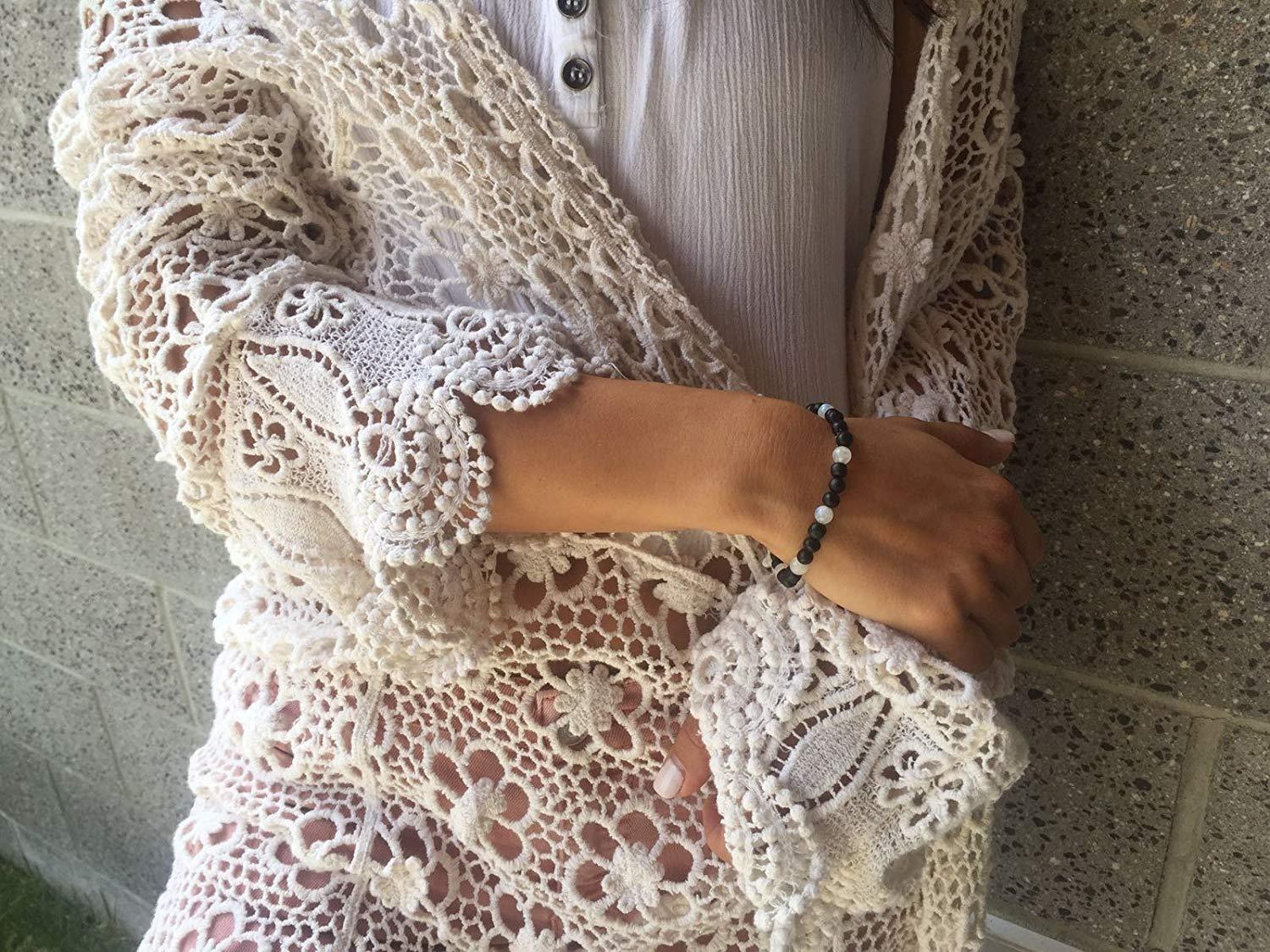 Handcrafted Fertility Amber Bracelet featuring raw Baltic amber and various gemstones for enhancing fertility and emotional balance.