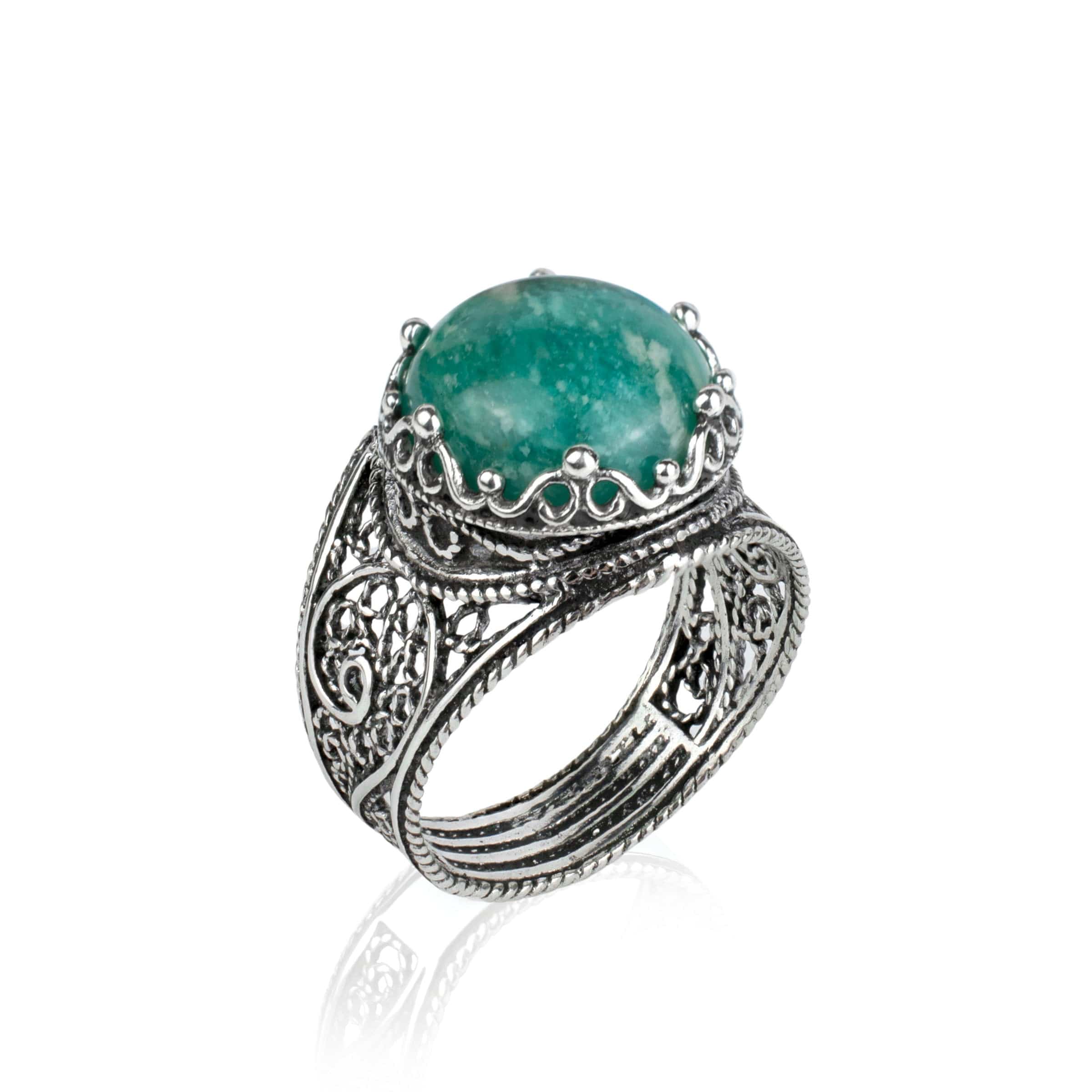 Handmade sterling silver cocktail ring featuring a crown design with a natural Amazonite gemstone, showcasing intricate filigree art.