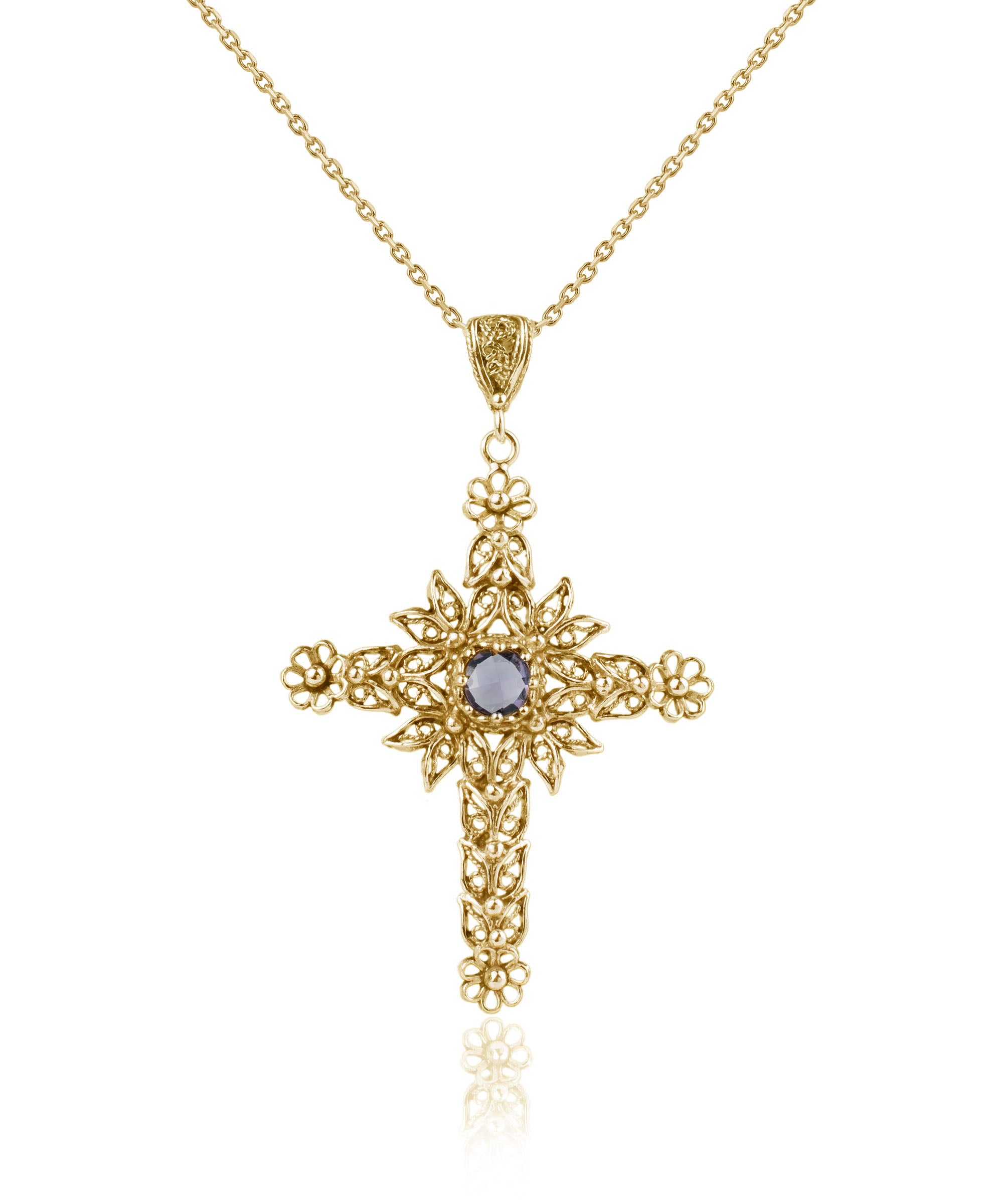 Gold plated silver cross pendant featuring intricate filigree art and a beautiful Amethyst gemstone, perfect for women.