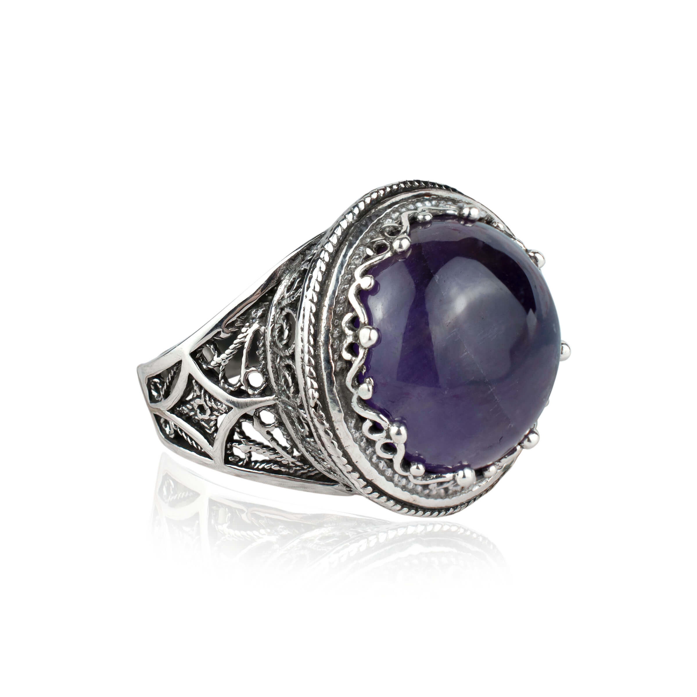 A stunning sterling silver filigree ring featuring a 16mm round cut amethyst gemstone, showcasing intricate metalwork and a polished finish.
