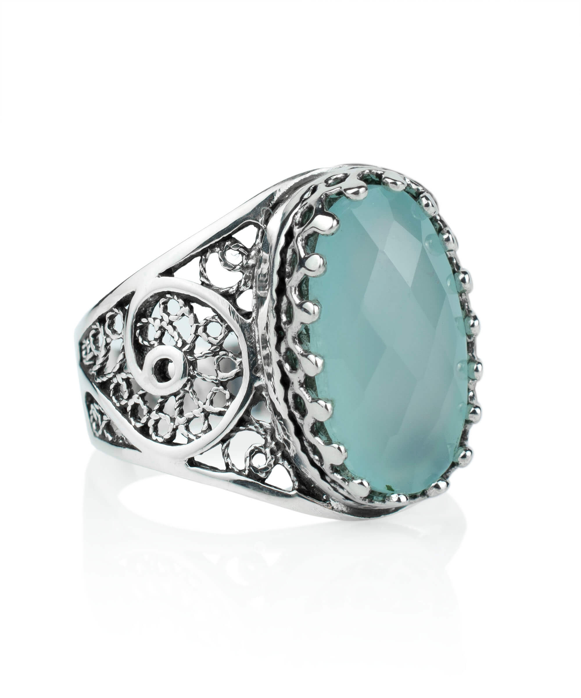 Elegant silver cocktail ring featuring a natural Aqua Chalcedony gemstone in a filigree art design, showcasing intricate metalwork.