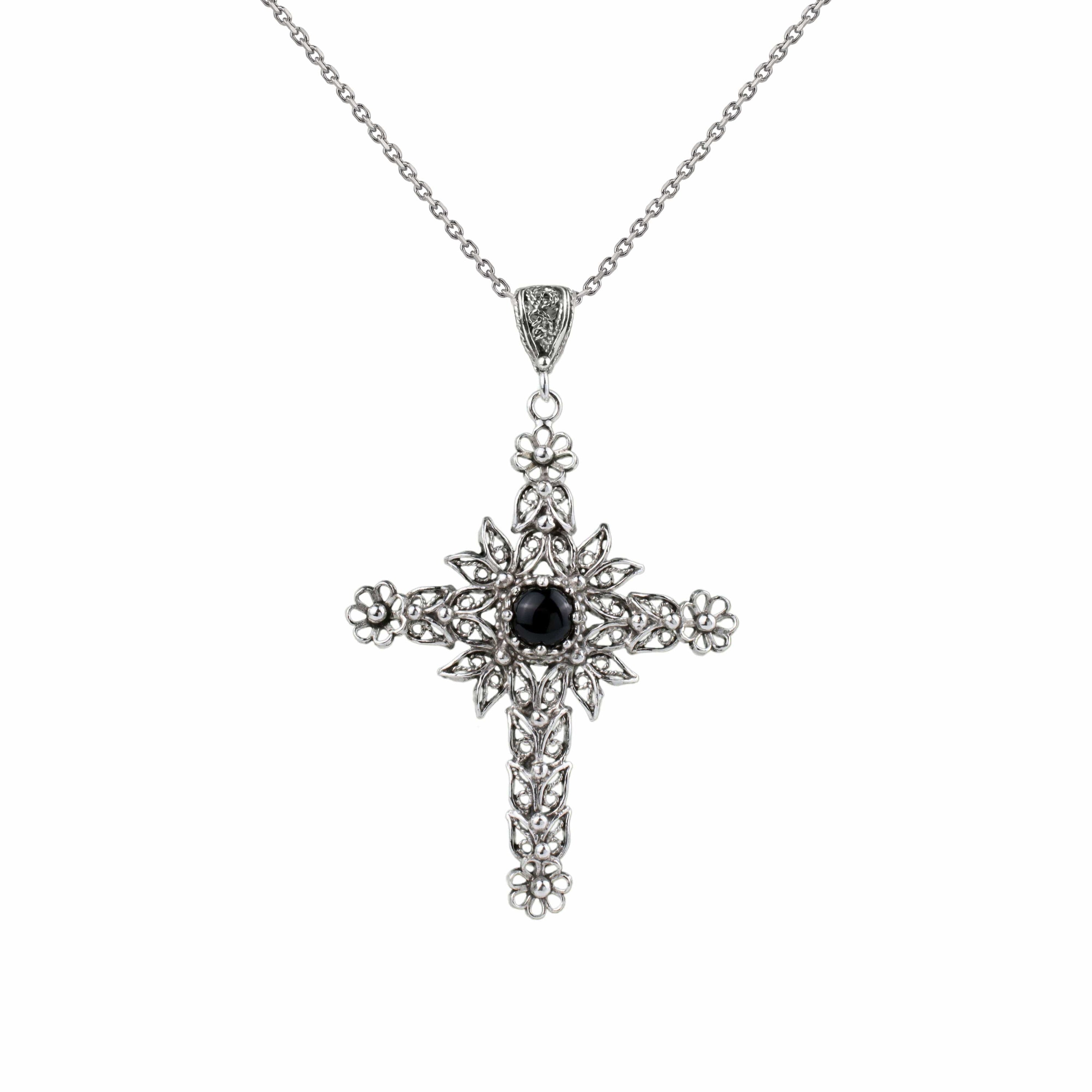 Elegant sterling silver cross pendant necklace featuring intricate filigree design and a black onyx gemstone centerpiece.