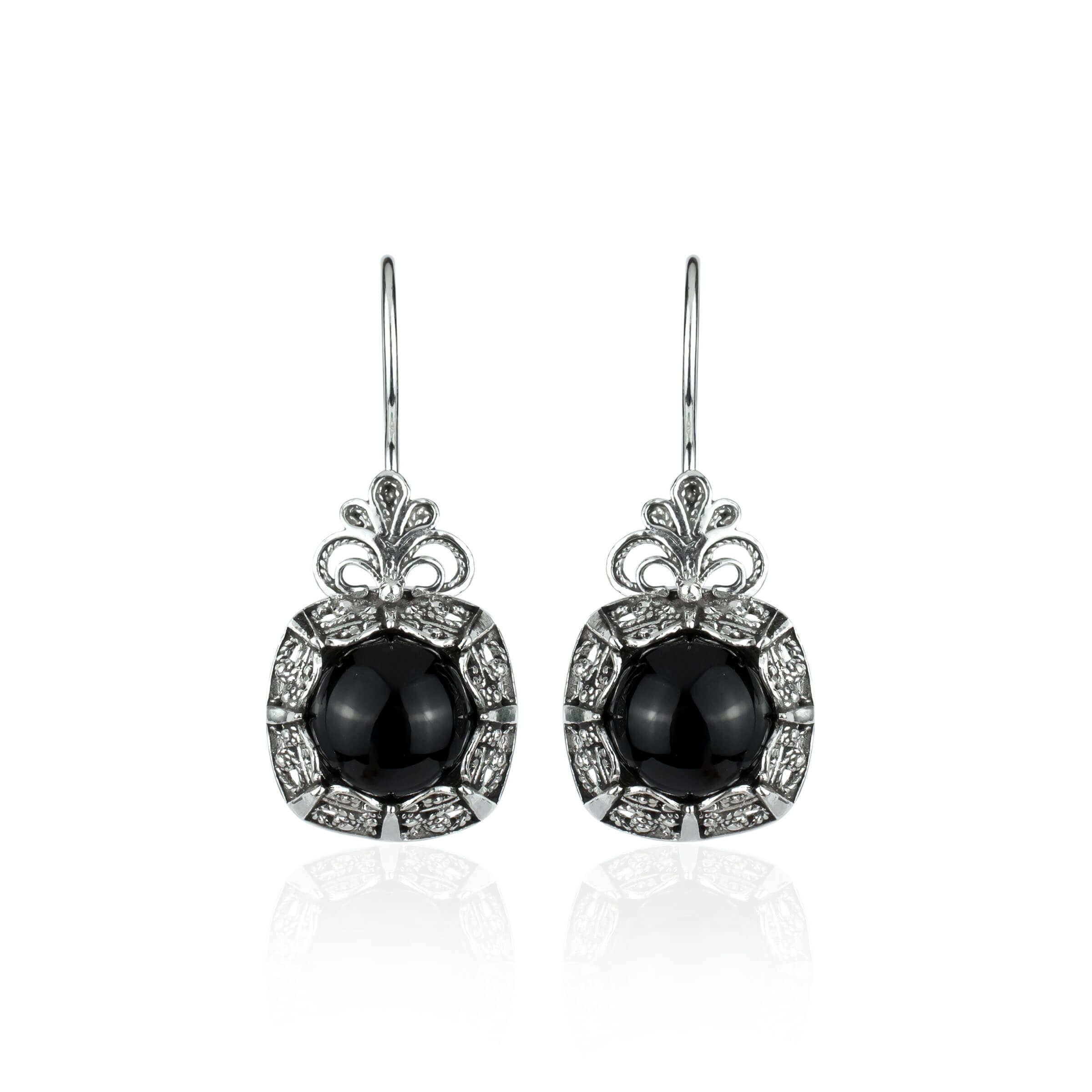 Elegant handmade silver drop earrings featuring intricate filigree design and black onyx gemstone.
