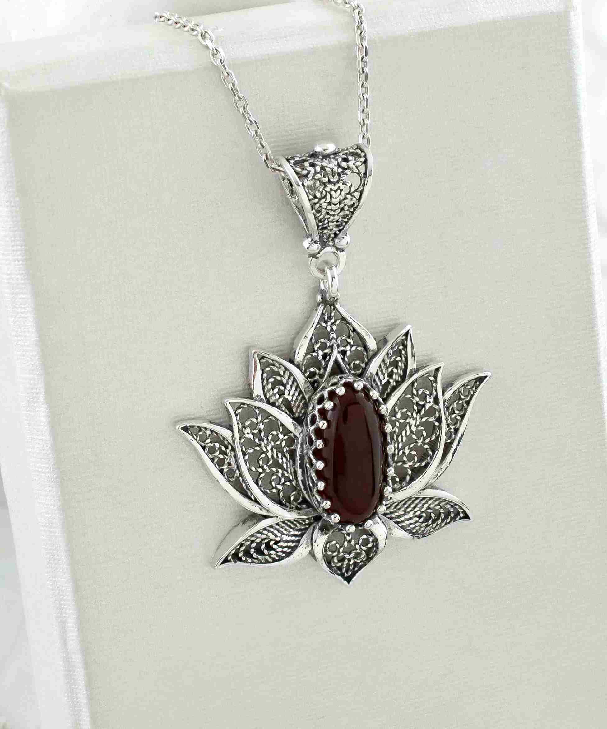 Elegant 925 Sterling Silver necklace featuring a filigree lotus flower design with a vibrant Carnelian gemstone.
