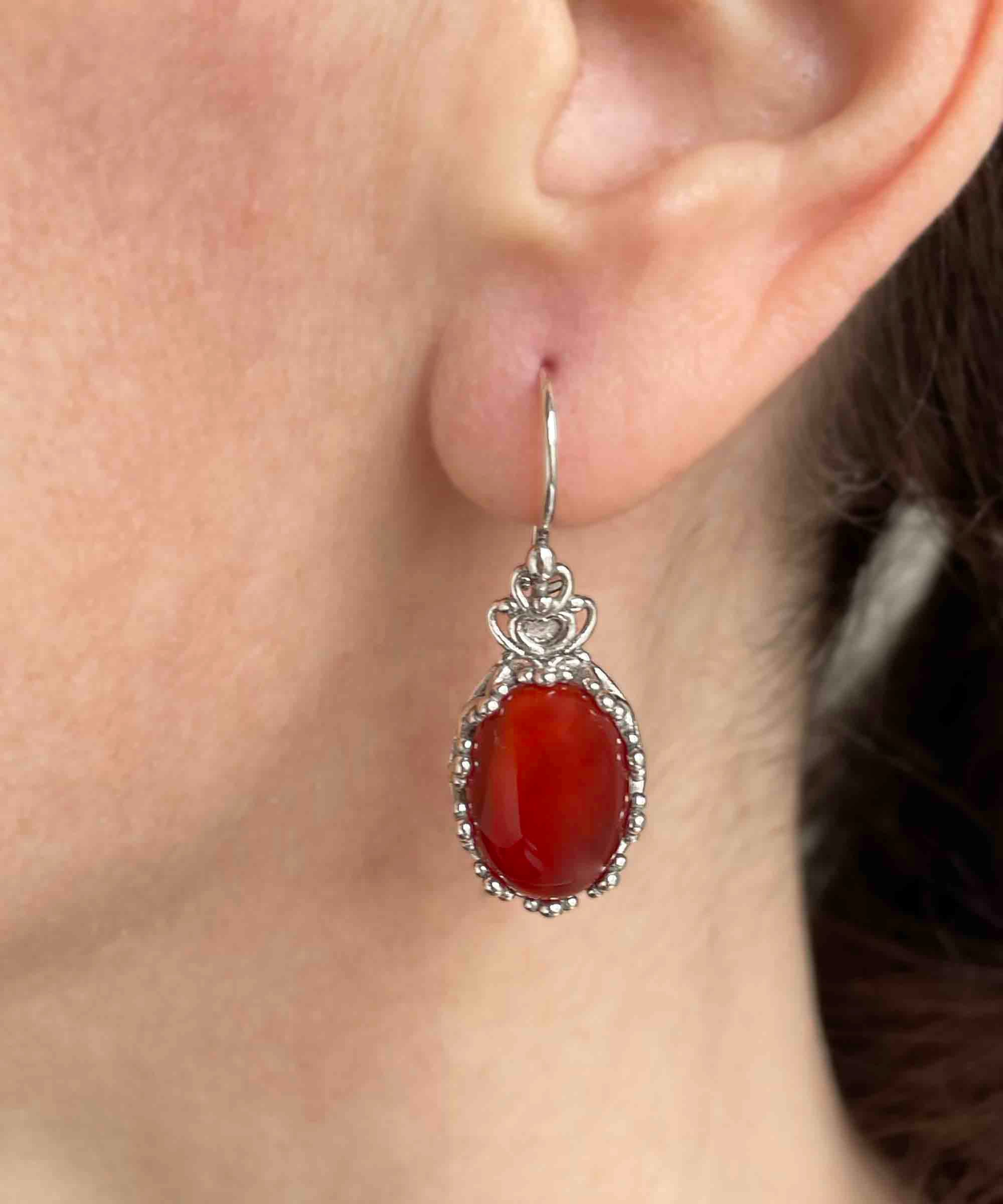 Elegant Filigree Art Carnelian Gemstone Crown Earrings in sterling silver, featuring intricate design and warm reddish-orange gemstone.