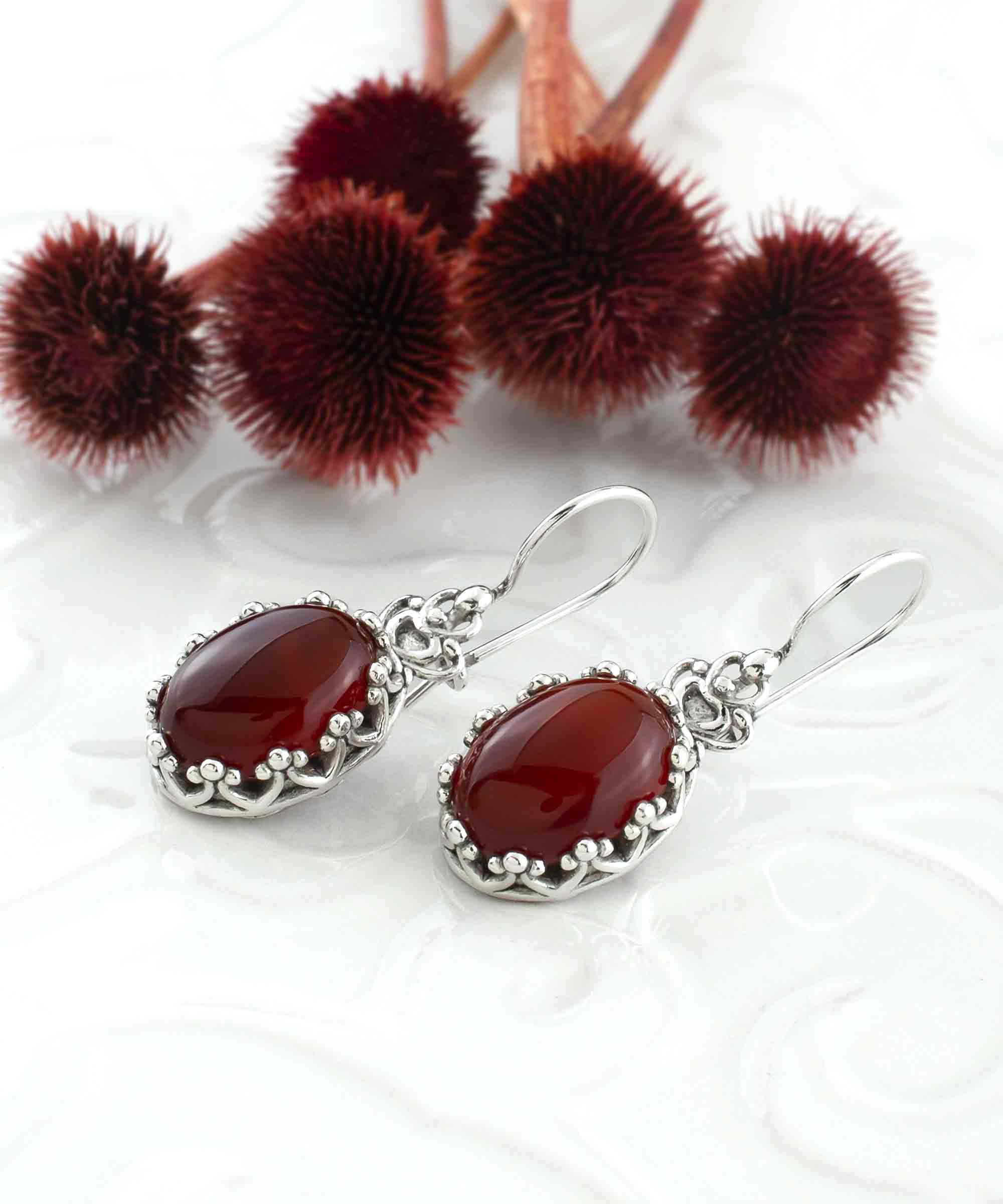 Elegant Filigree Art Carnelian Gemstone Crown Earrings in sterling silver, featuring intricate design and warm reddish-orange gemstone.