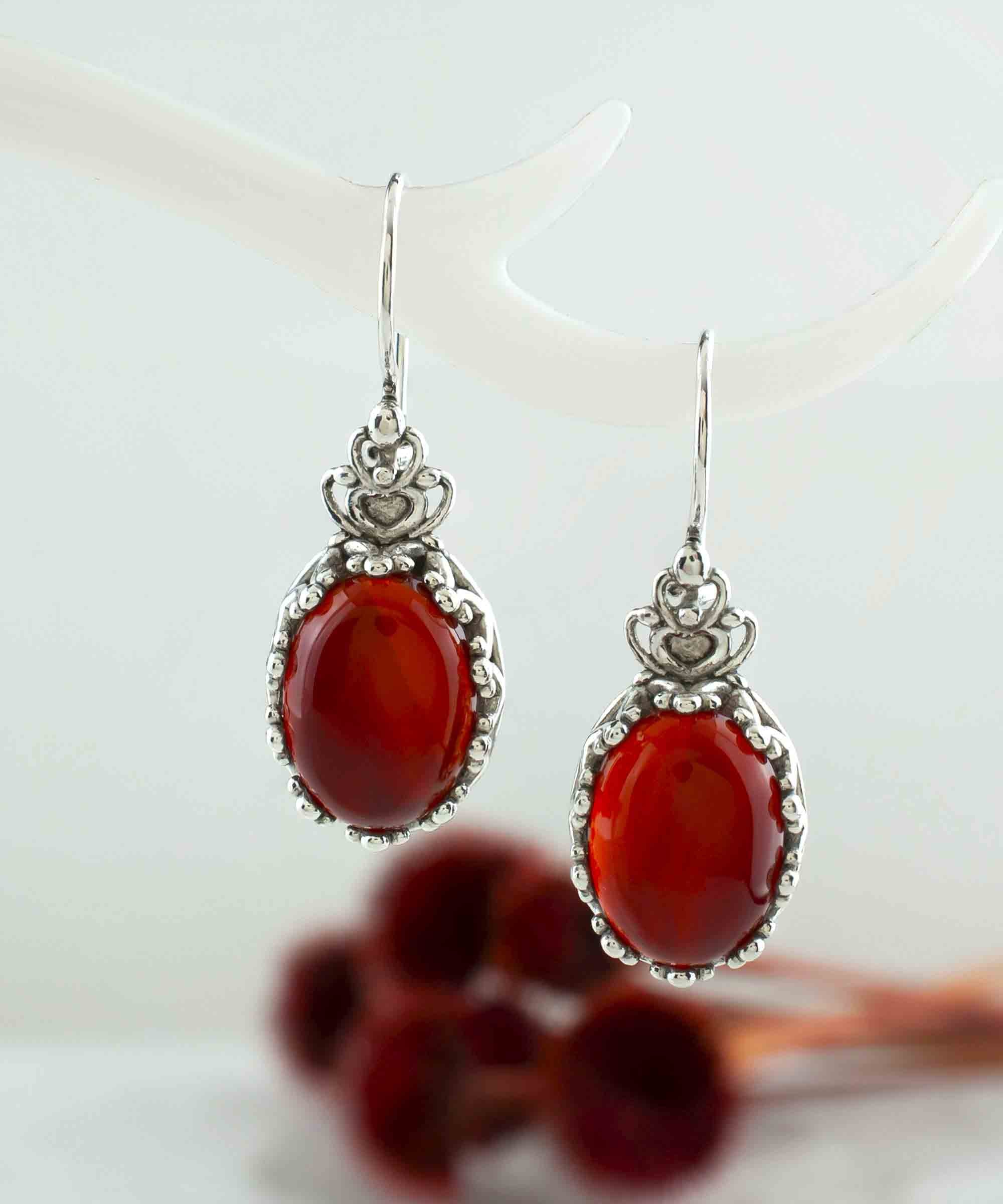 Elegant Filigree Art Carnelian Gemstone Crown Earrings in sterling silver, featuring intricate design and warm reddish-orange gemstone.