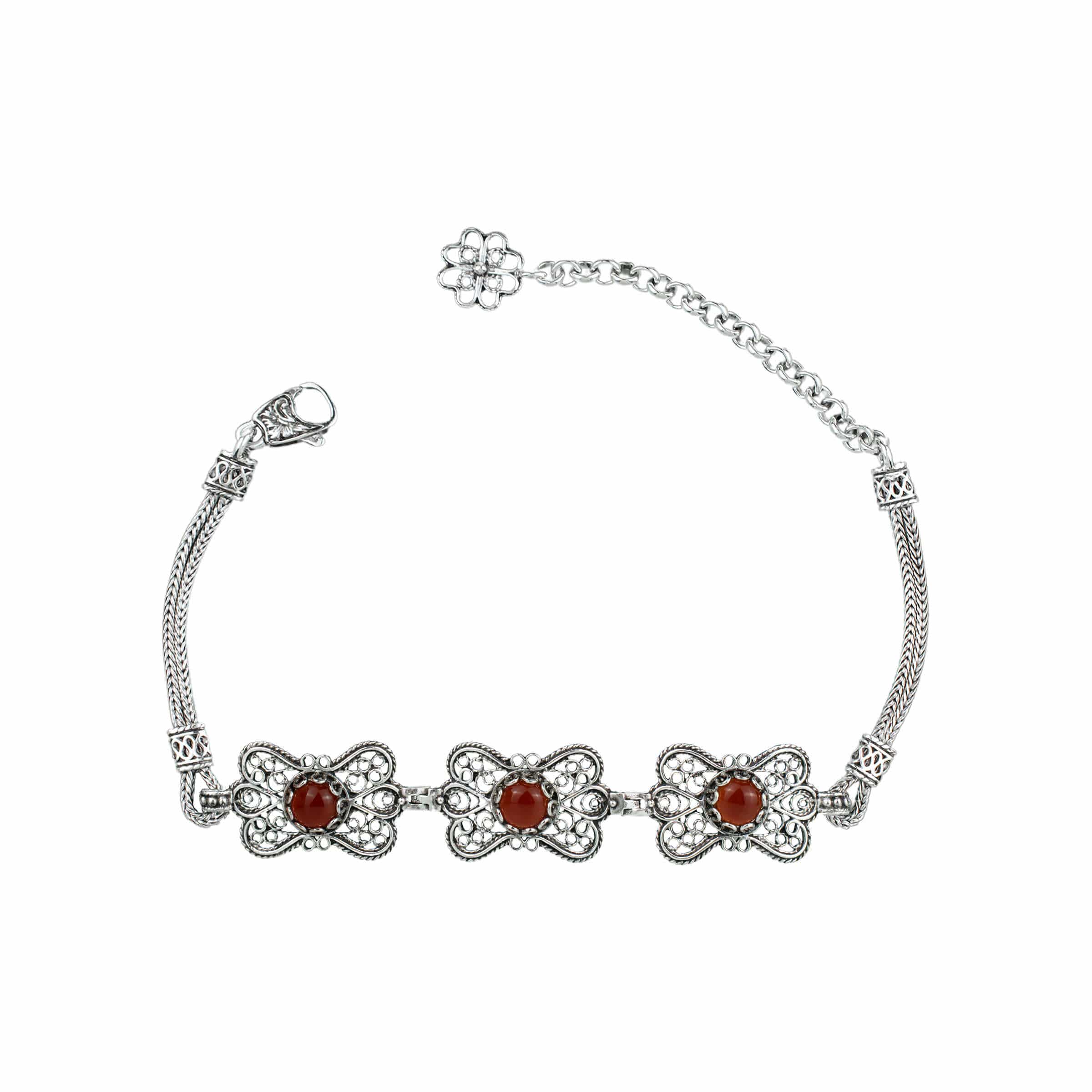 Elegant silver link bracelet featuring a butterfly design and a natural Carnelian gemstone, showcasing intricate filigree art.