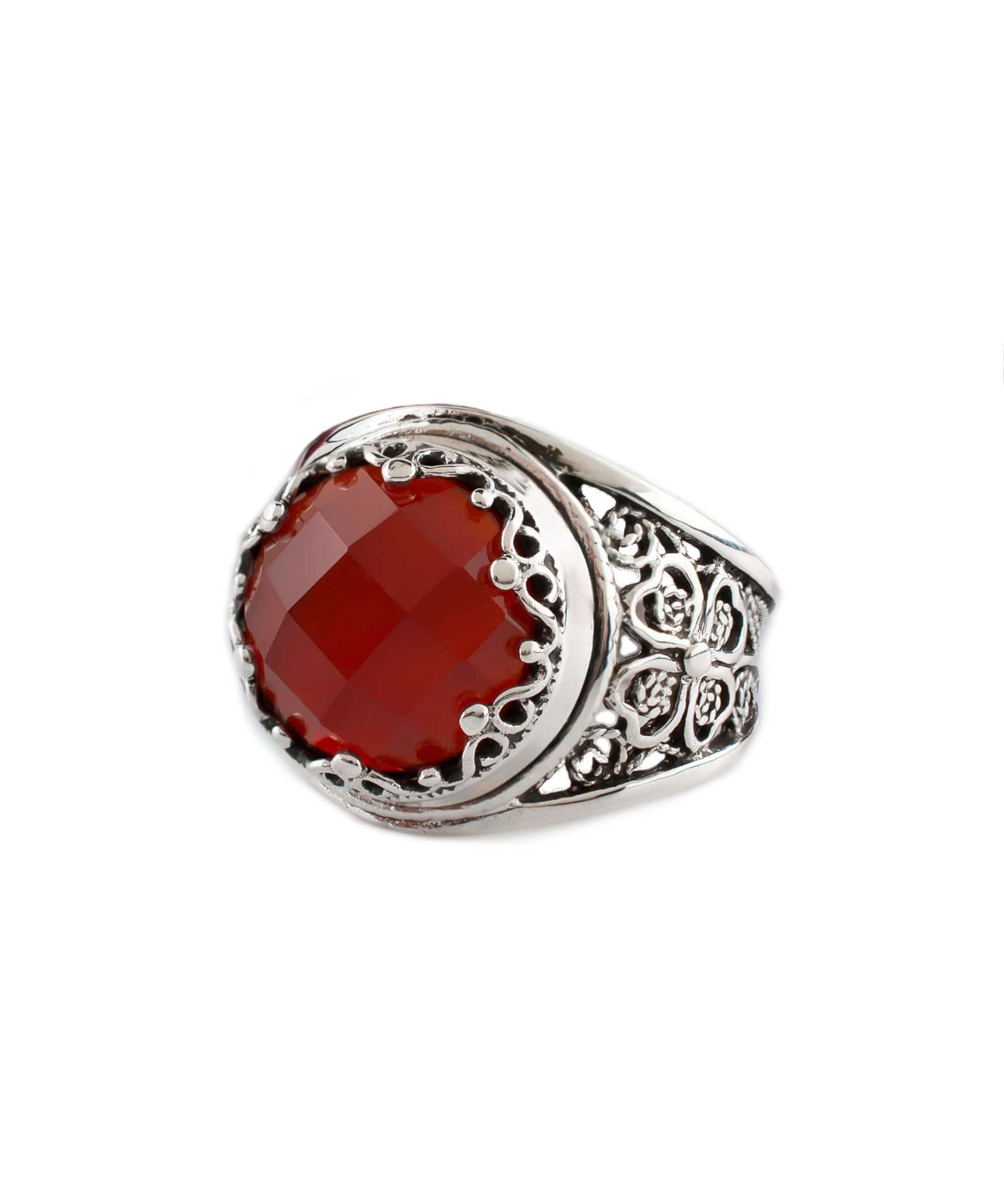 A stunning sterling silver filigree ring featuring a round, faceted rose-cut carnelian gemstone, elegantly designed for women.