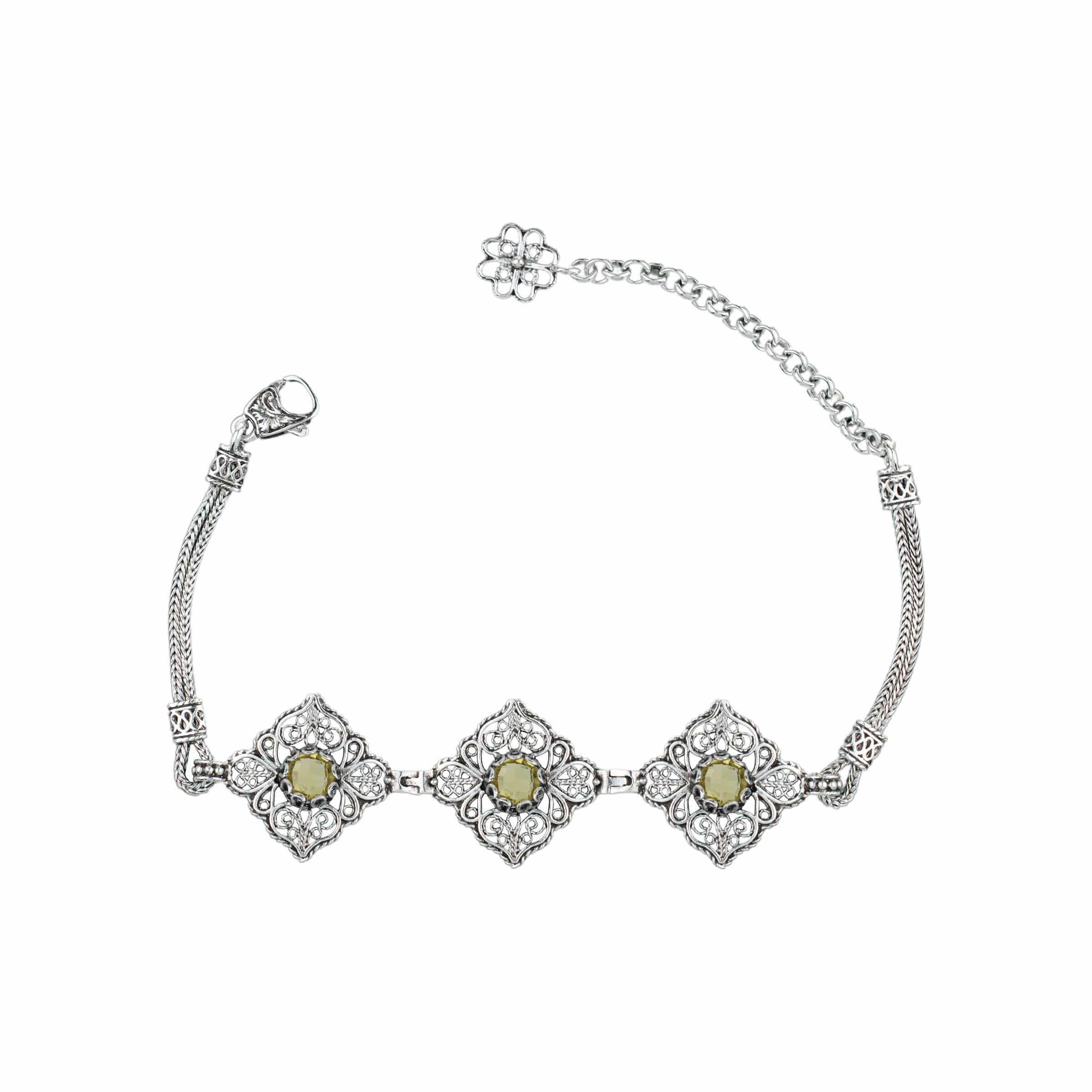 Elegant adjustable silver link bracelet featuring filigree art and a faceted citrine gemstone, perfect for women.