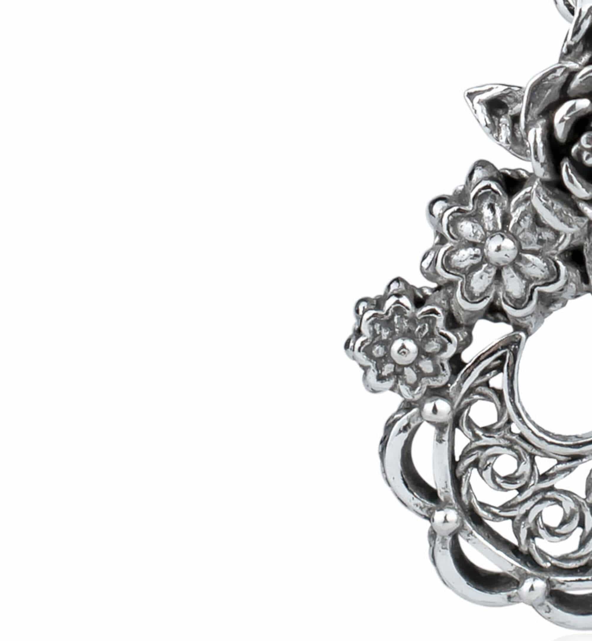 Handmade sterling silver dangle earrings featuring a filigree bucket of flowers design, showcasing intricate detailing and an antique-inspired finish.