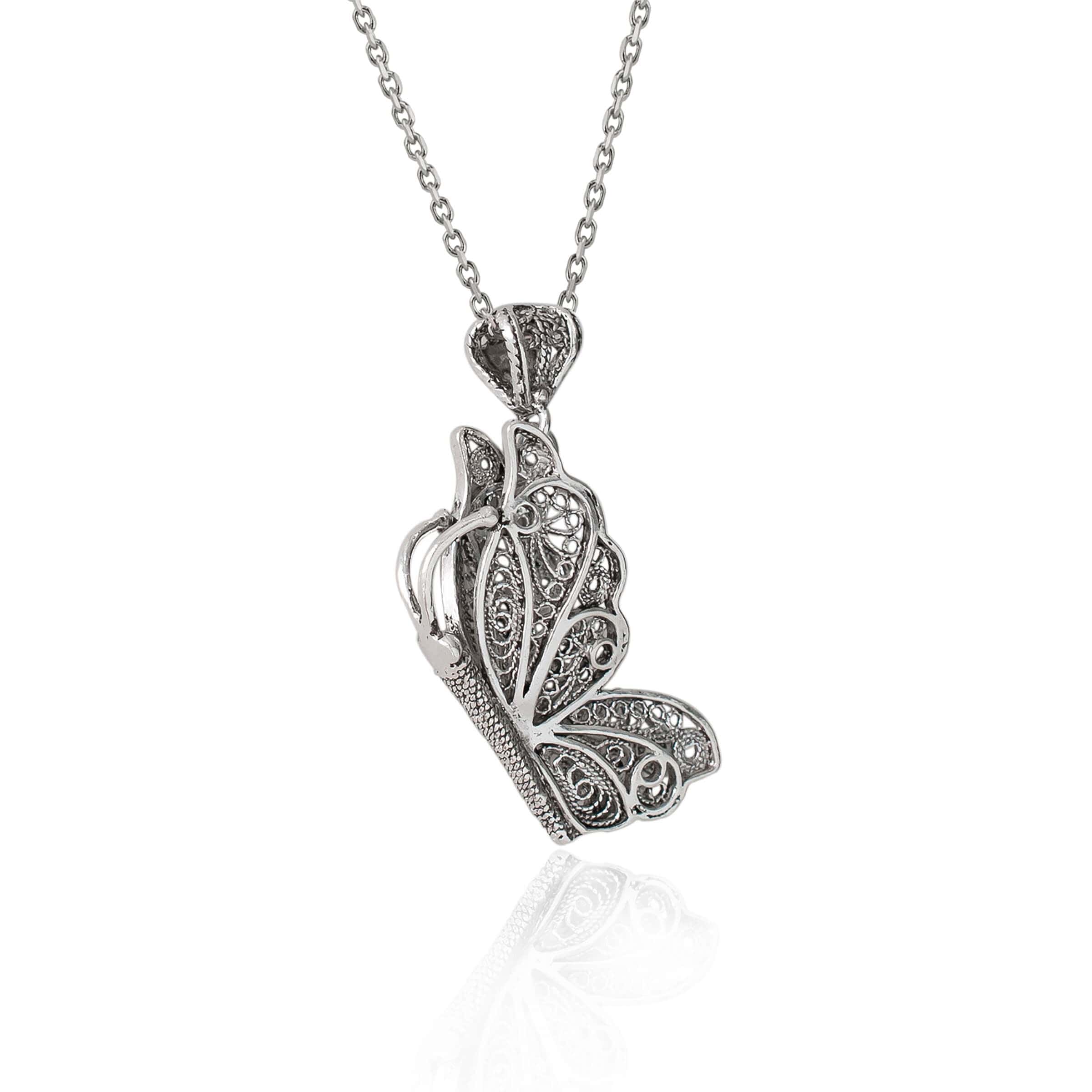 Sterling silver filigree butterfly pendant necklace with an 18-inch chain and extender, showcasing intricate craftsmanship.
