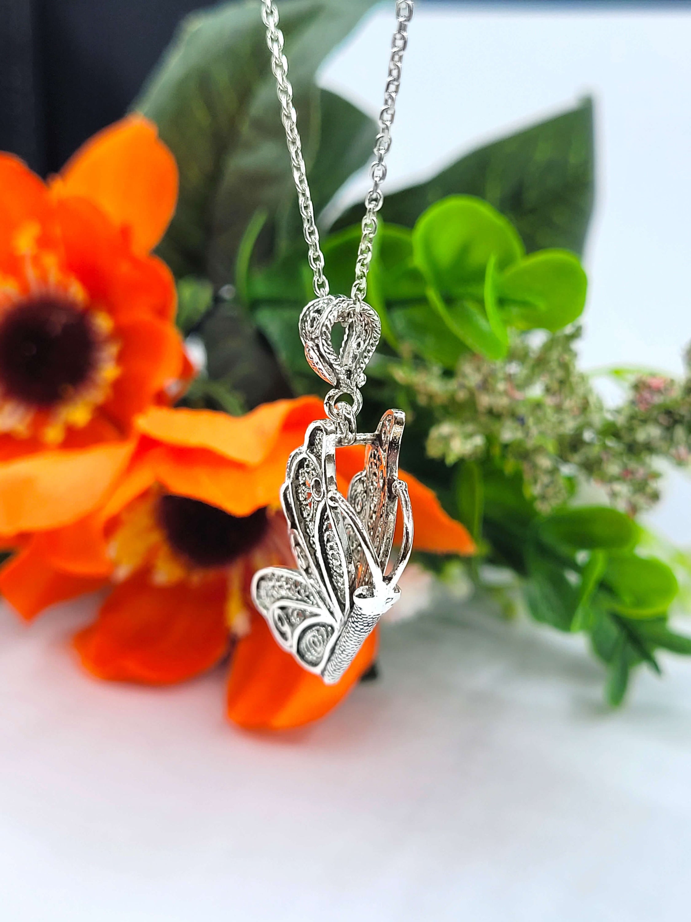 Sterling silver filigree butterfly pendant necklace with an 18-inch chain and extender, showcasing intricate craftsmanship.