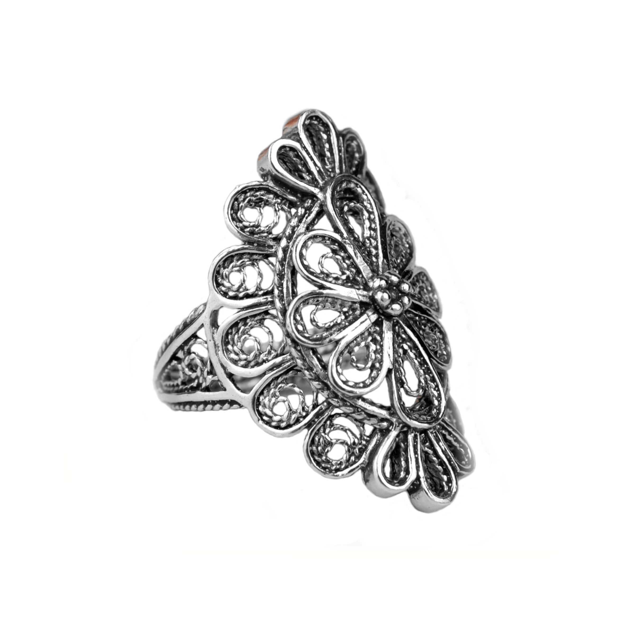 A stunning long statement ring made of sterling silver featuring intricate filigree lace detailing, showcasing a blend of traditional and modern artistry.