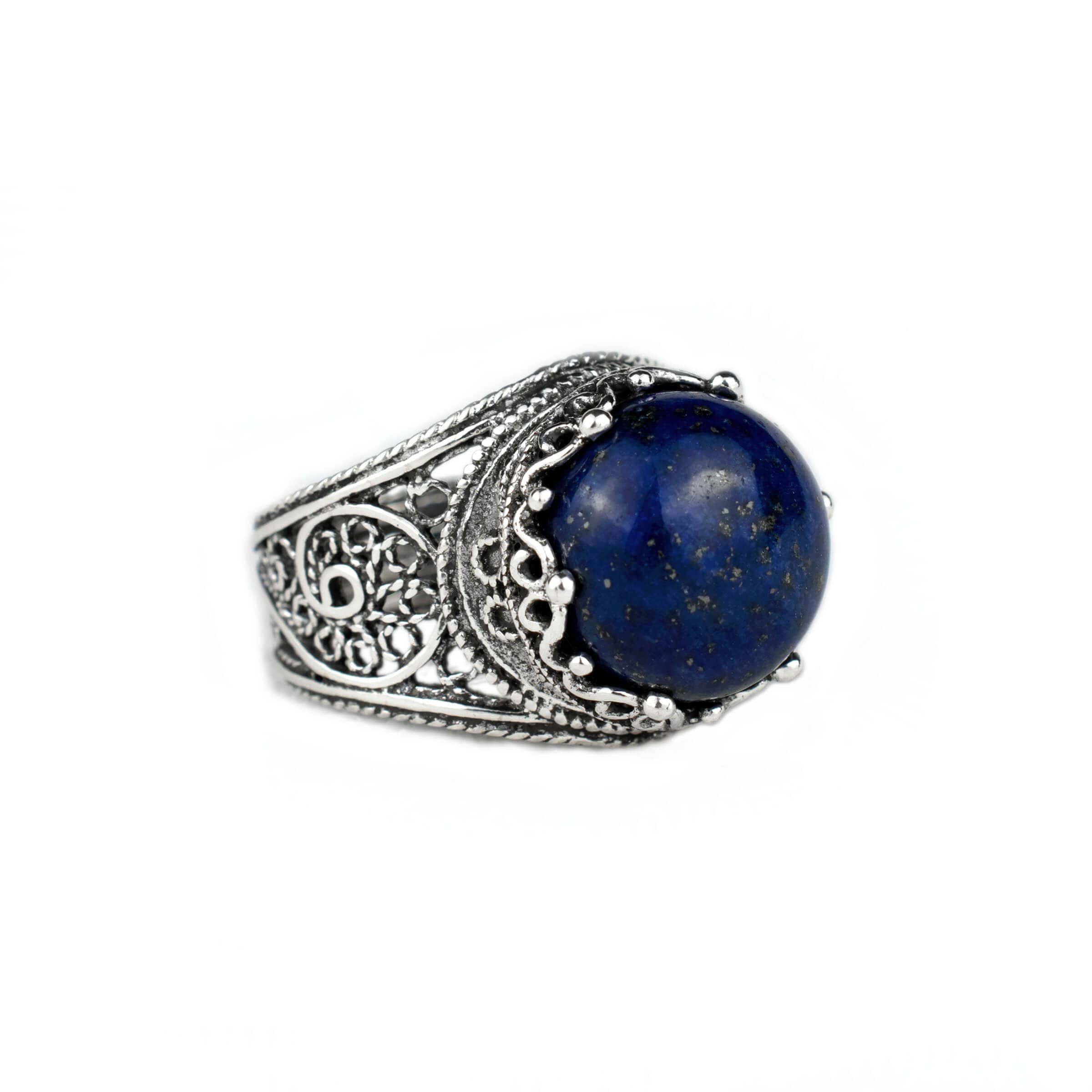 Handmade silver cocktail ring featuring a natural Lapis Lazuli gemstone in a filigree crown design, showcasing intricate craftsmanship.