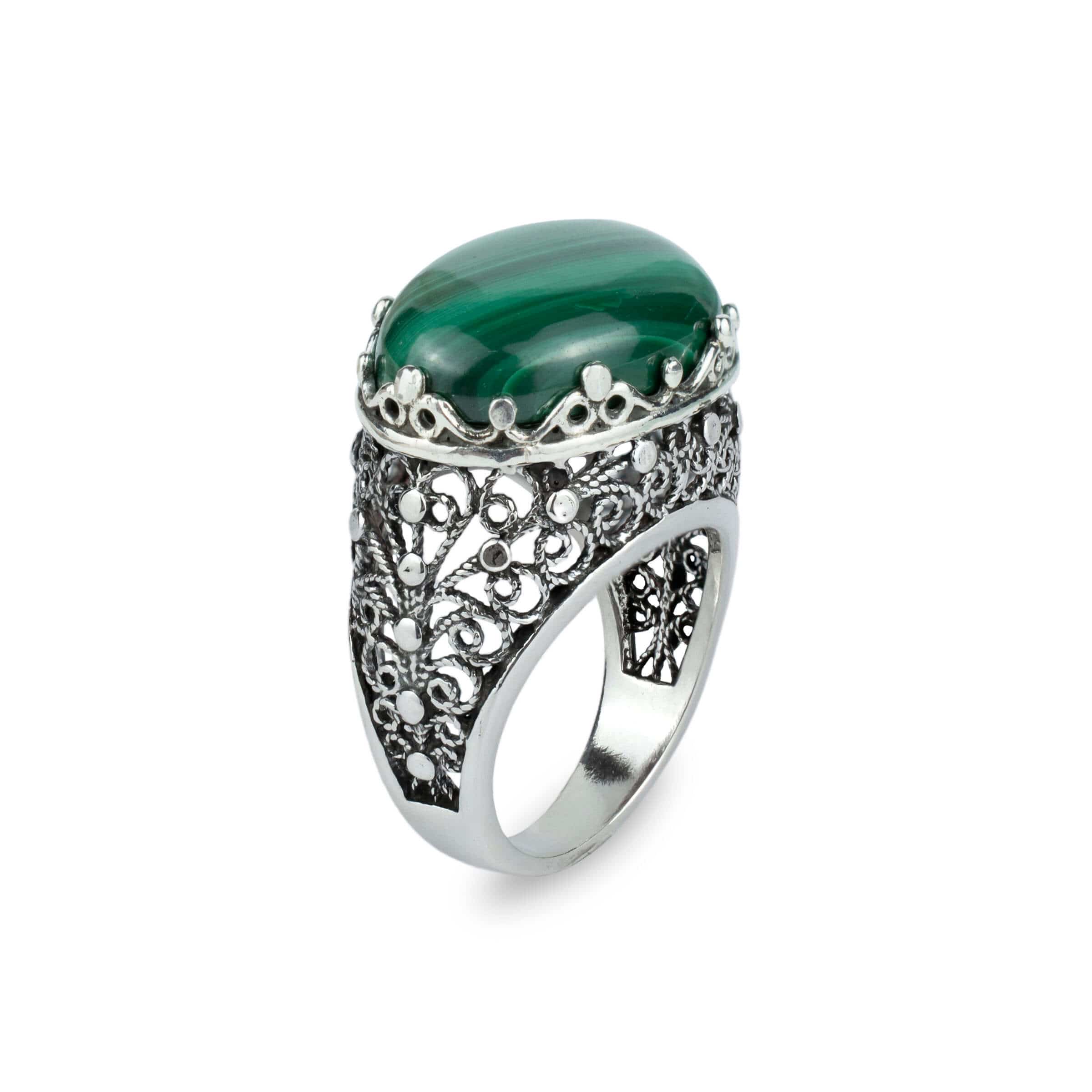 Handmade silver dome statement ring featuring a natural malachite gemstone with intricate filigree design.