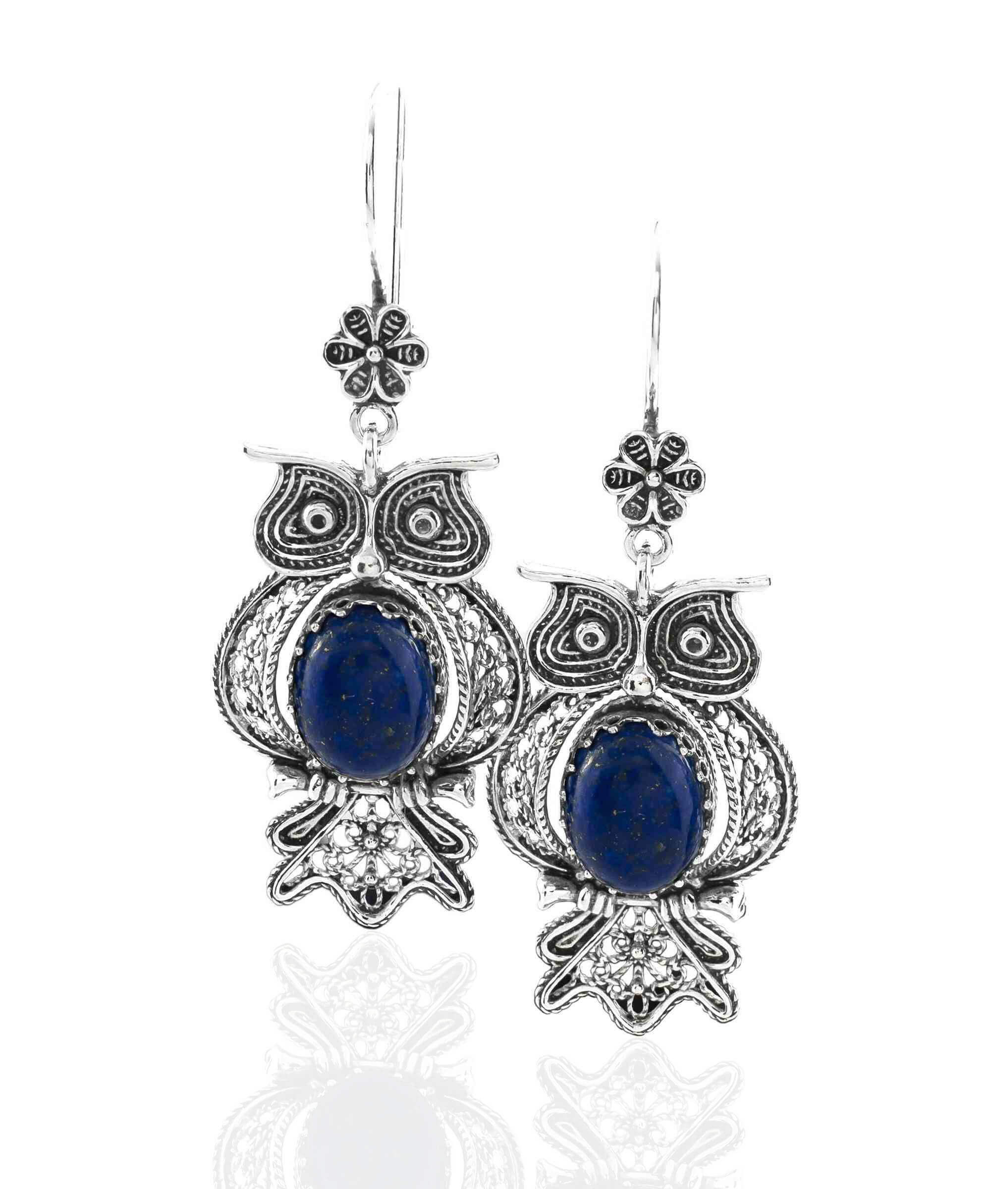Elegant silver dangle earrings featuring owl design and Lapis Lazuli gemstone, showcasing intricate filigree craftsmanship.