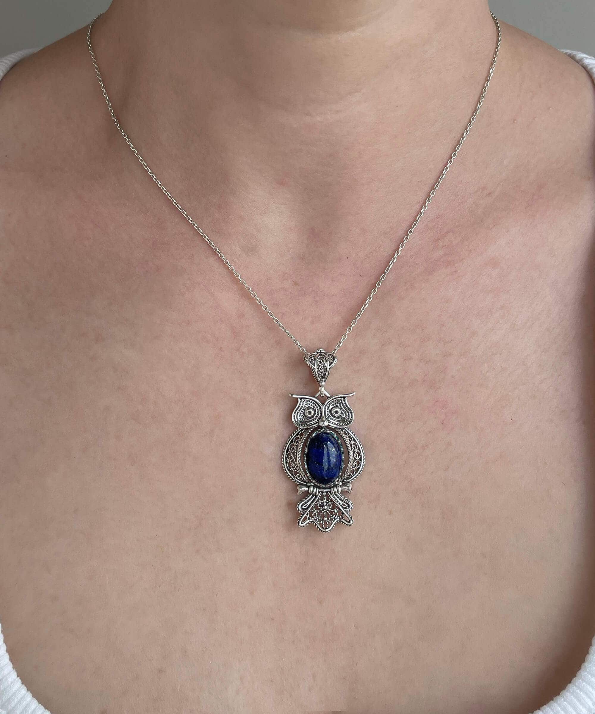 Elegant 925 Sterling Silver owl pendant featuring Lapis Lazuli gemstone, showcasing intricate filigree art design.