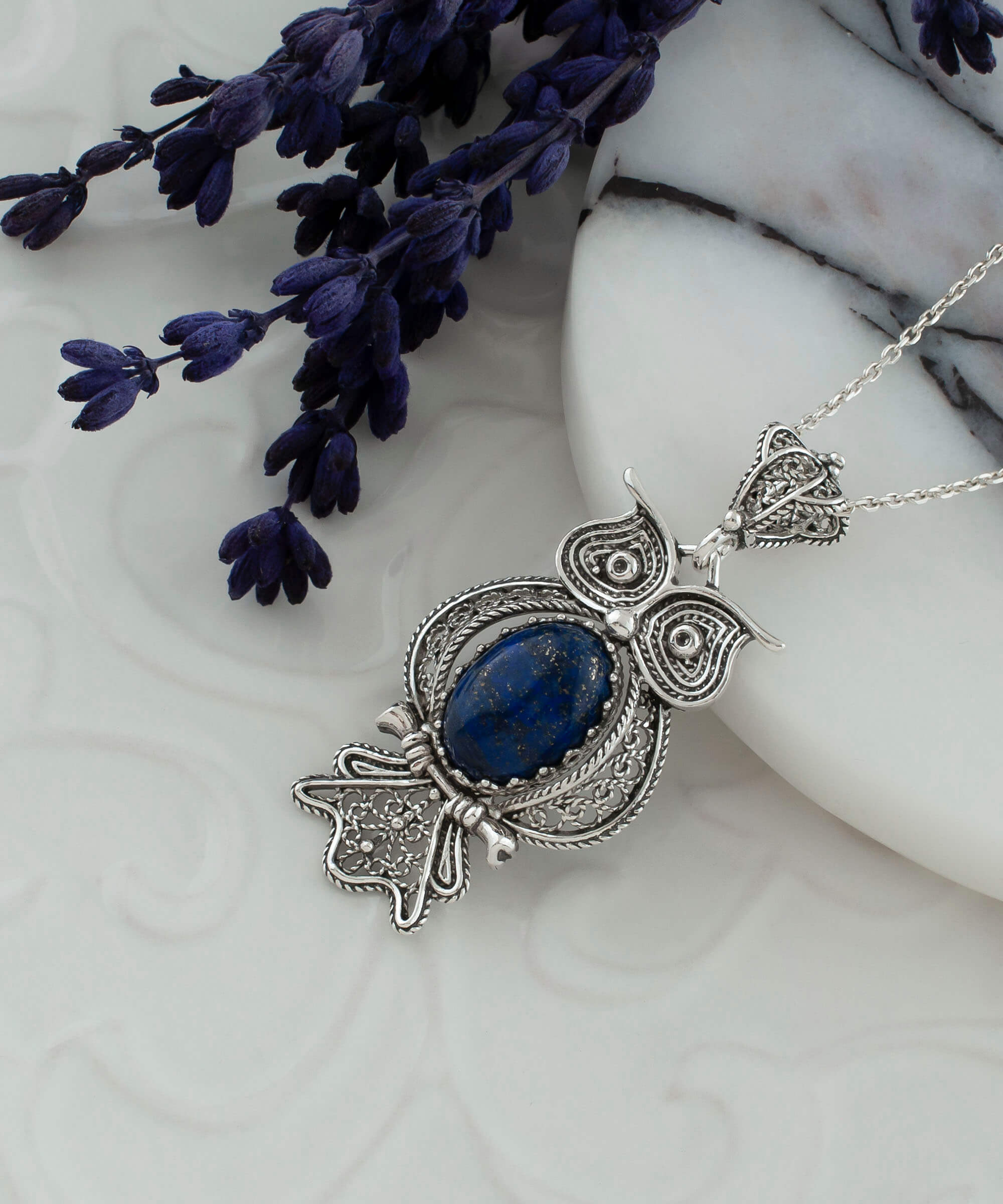 Elegant 925 Sterling Silver owl pendant featuring Lapis Lazuli gemstone, showcasing intricate filigree art design.