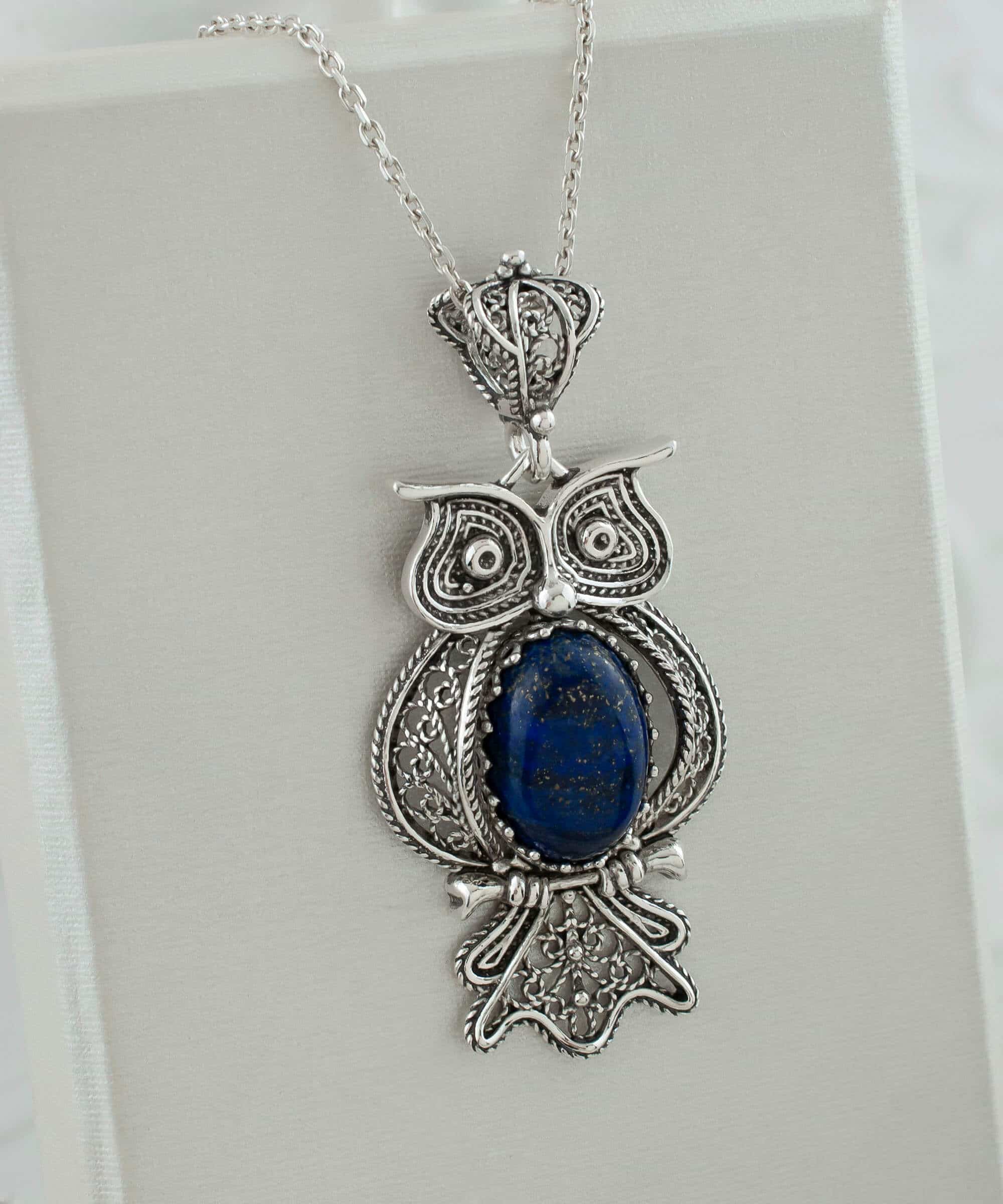 Elegant 925 Sterling Silver owl pendant featuring Lapis Lazuli gemstone, showcasing intricate filigree art design.