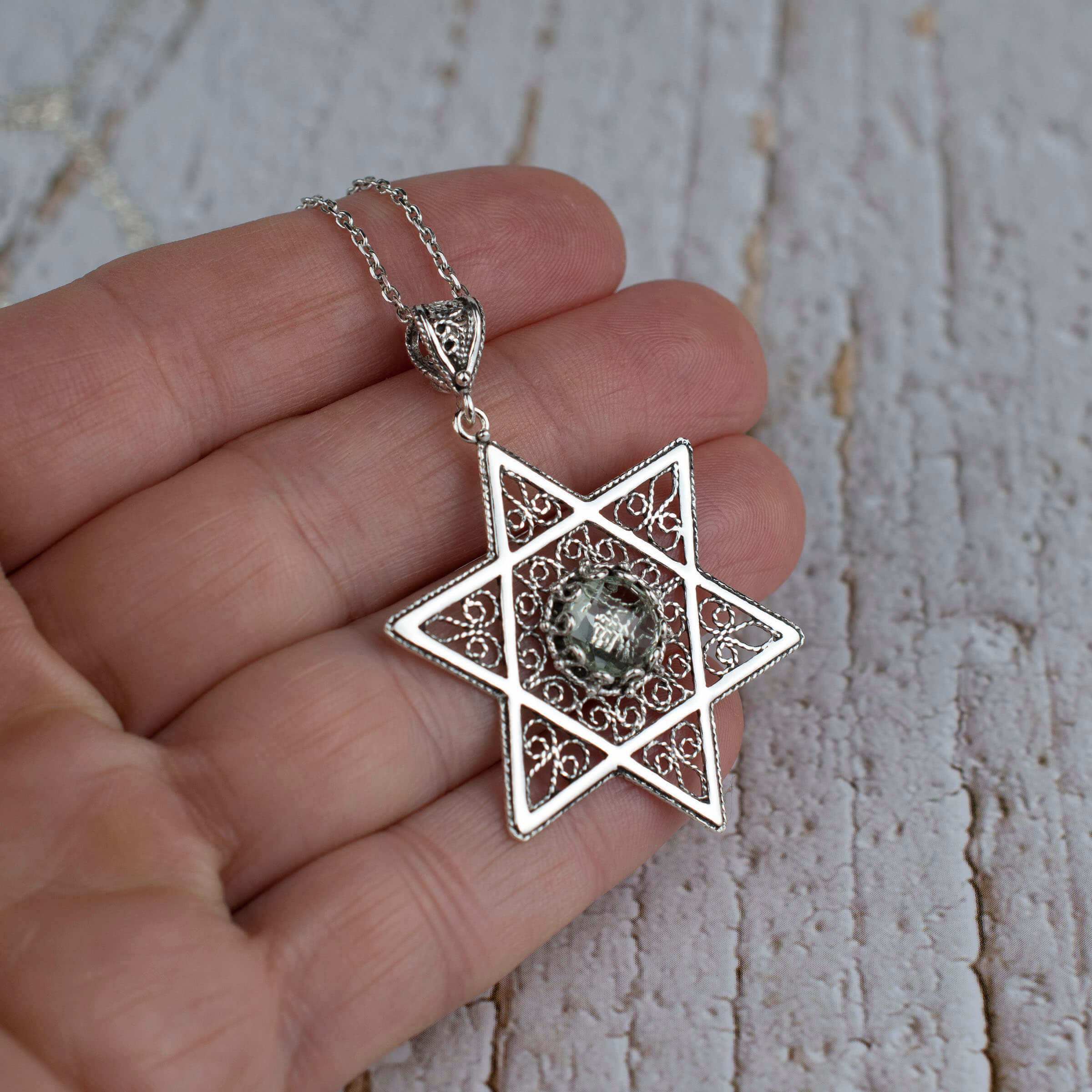 Sterling silver filigree art pendant featuring a prasiolite gemstone in the shape of a Star of David, elegantly designed for women.