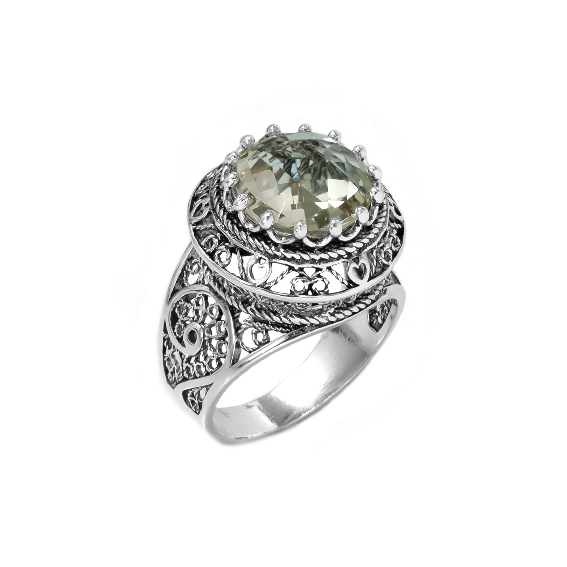A stunning silver statement ring featuring intricate filigree design and a round prasiolite gemstone, elegantly displayed in a luxurious gift box.