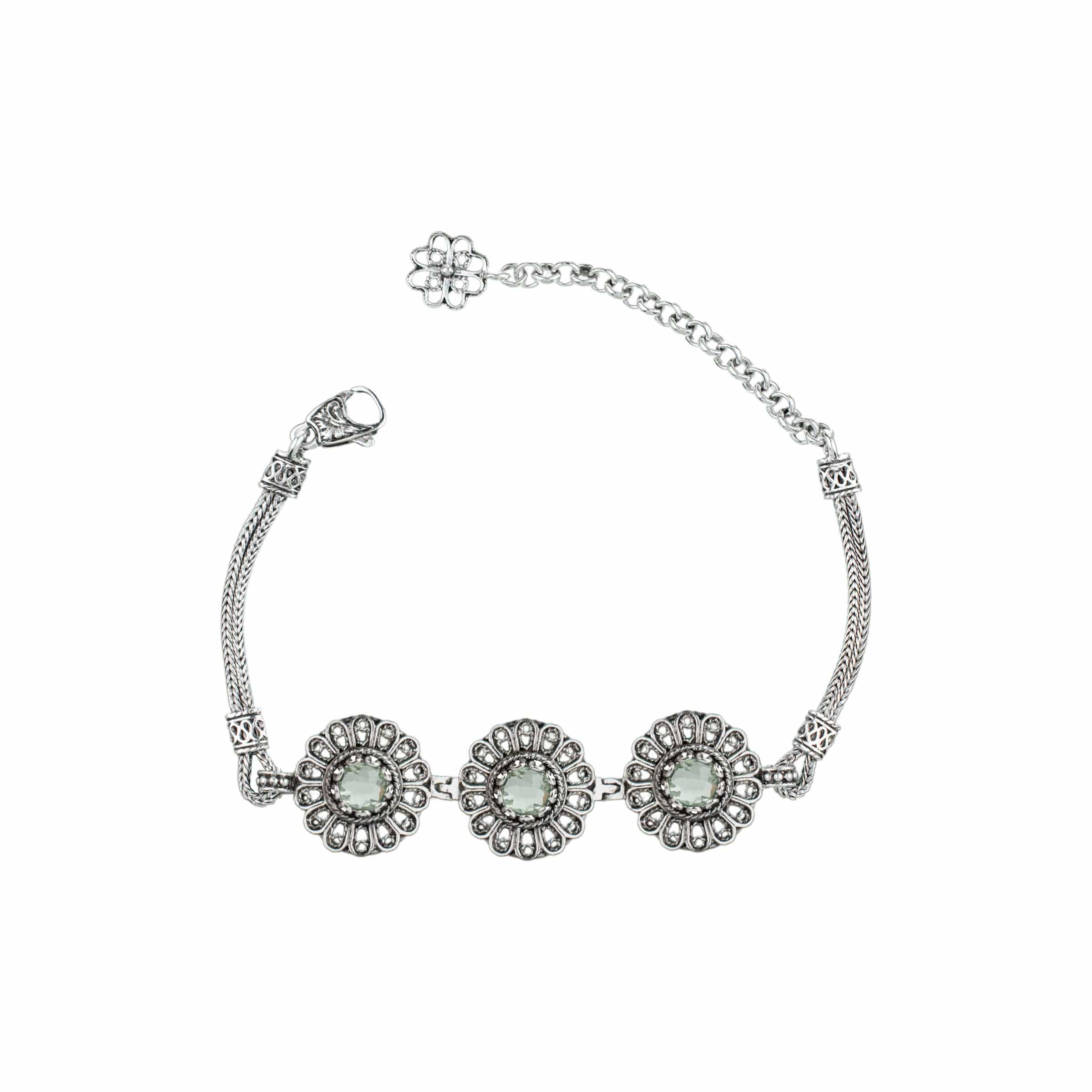 Elegant silver link bracelet featuring intricate filigree design and a stunning prasiolite green amethyst gemstone.