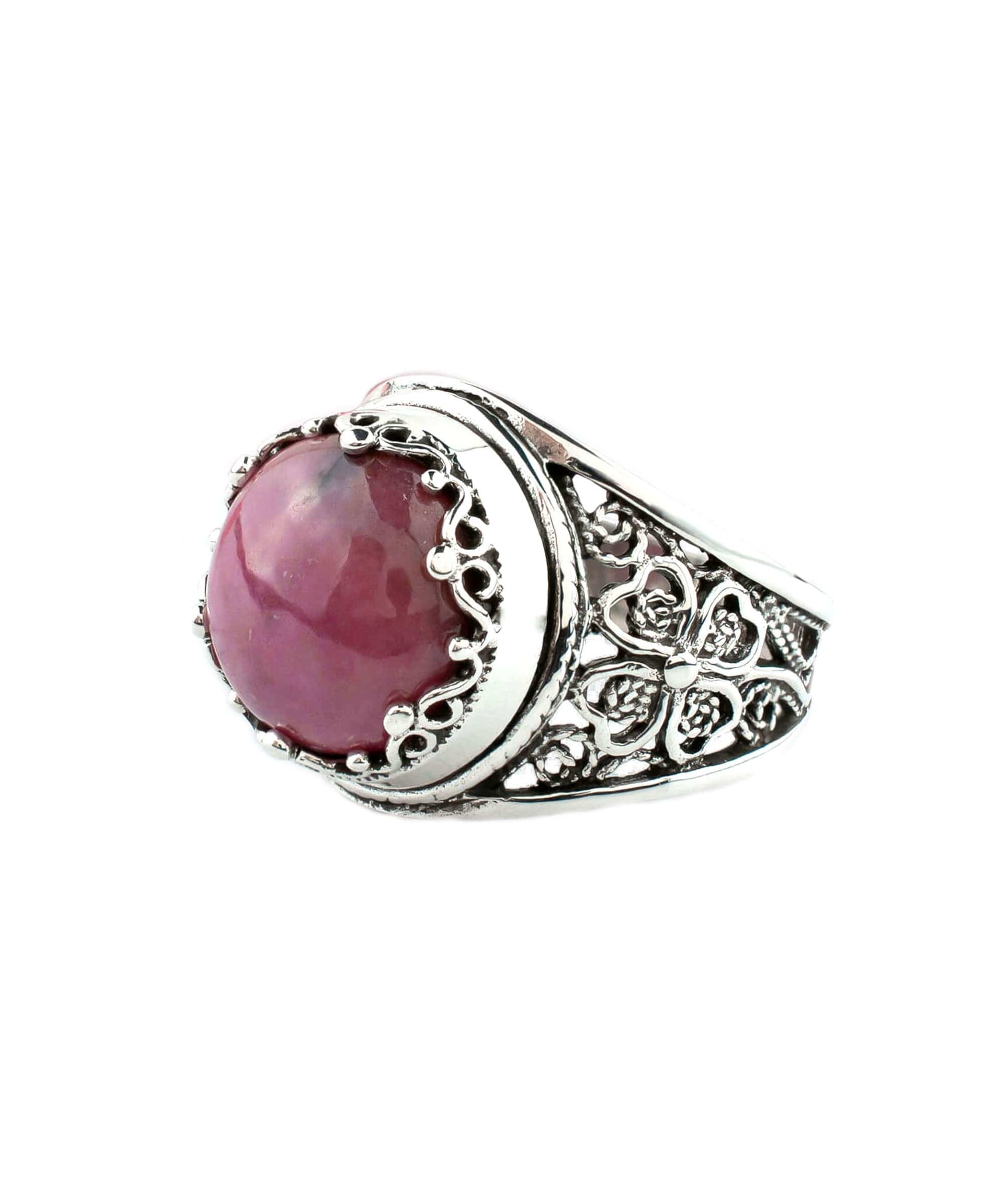 A stunning sterling silver filigree ring featuring a round cut rhodonite gemstone, elegantly designed for women.