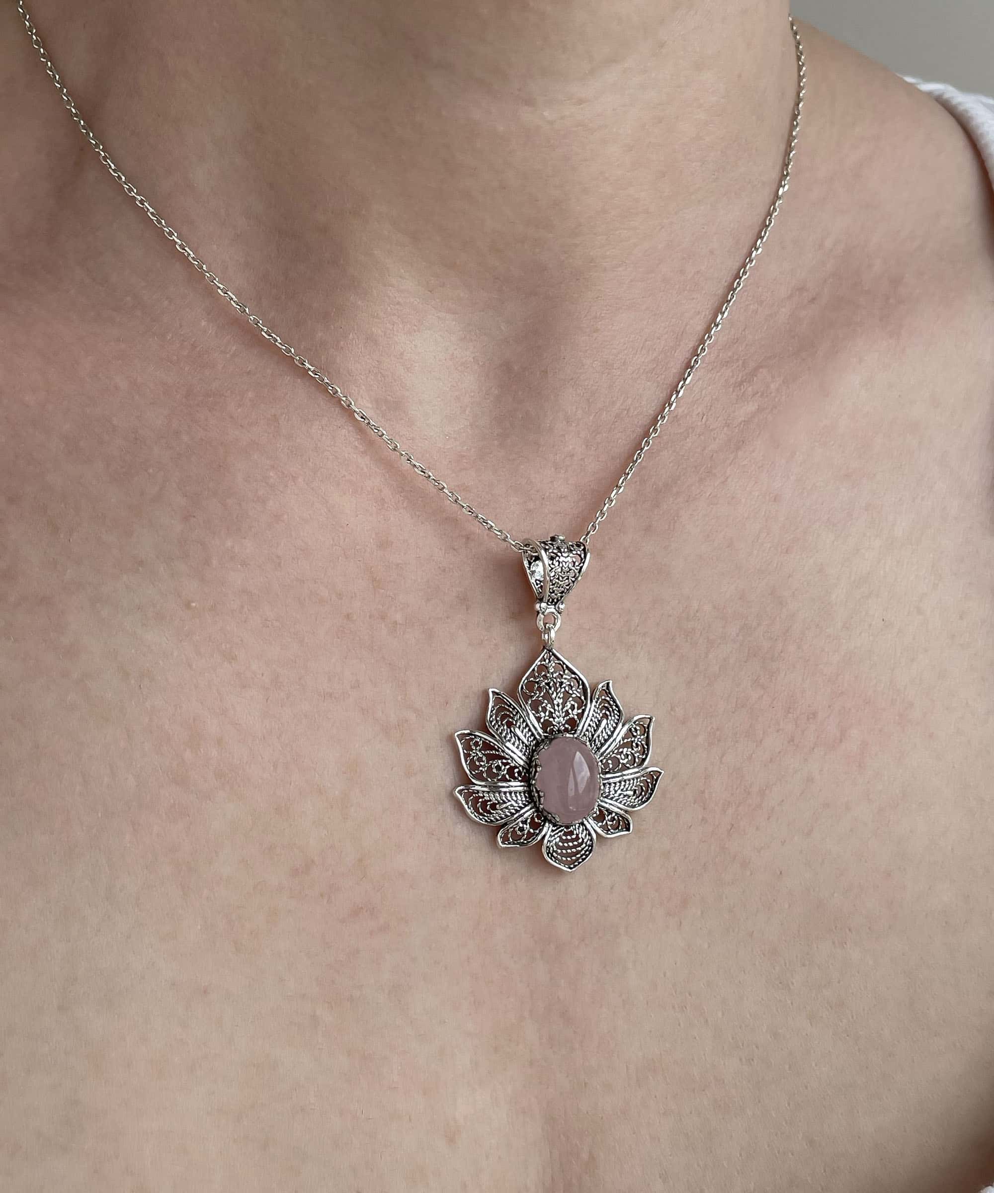 Elegant 925 Sterling Silver pendant featuring a rose quartz gemstone in a lotus flower design with intricate filigree art.