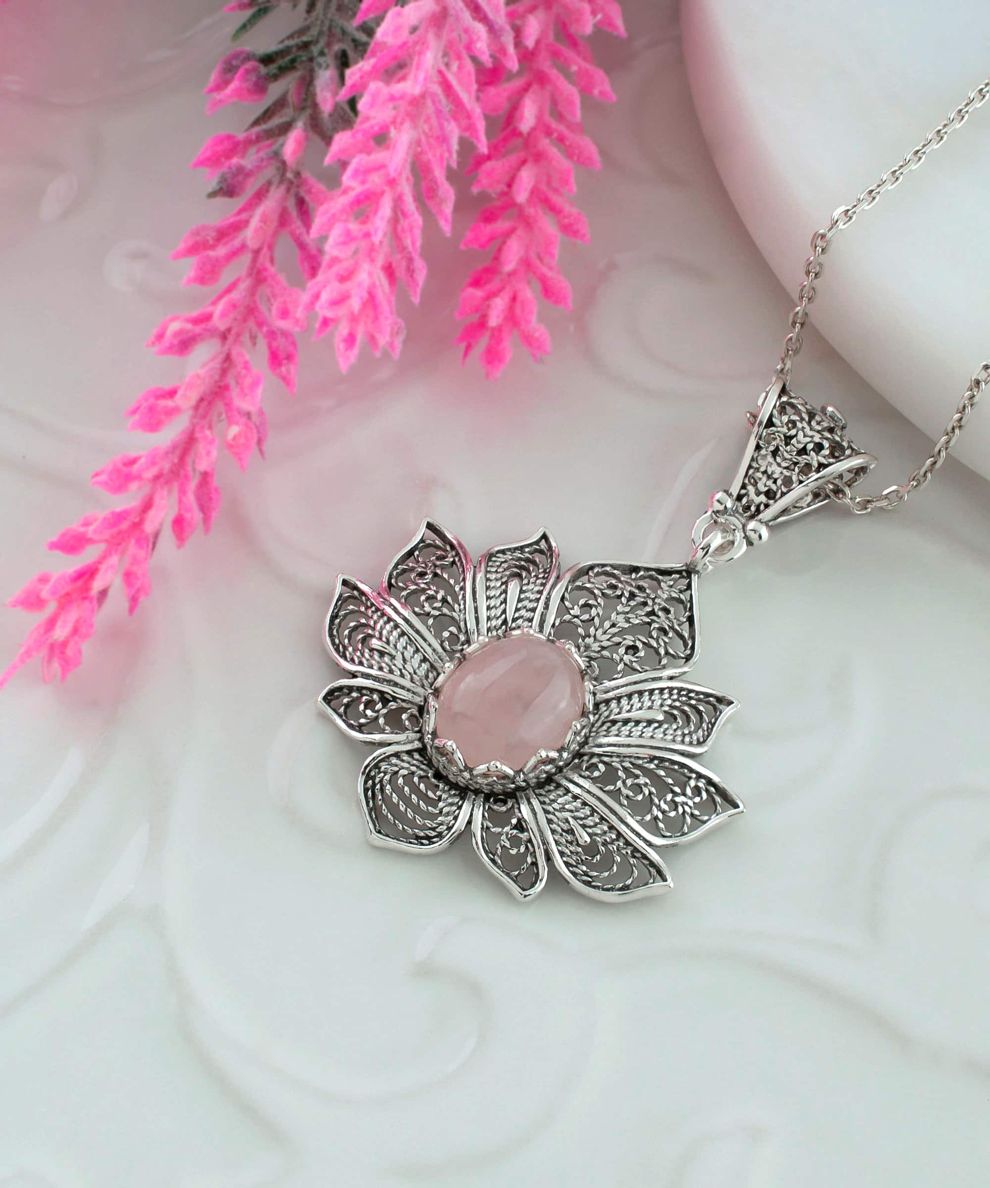 Elegant 925 Sterling Silver pendant featuring a rose quartz gemstone in a lotus flower design with intricate filigree art.
