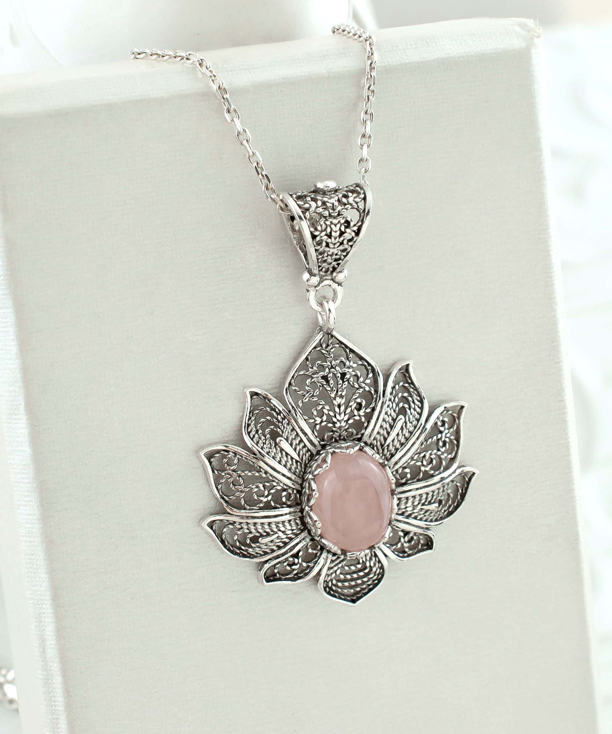 Elegant 925 Sterling Silver pendant featuring a rose quartz gemstone in a lotus flower design with intricate filigree art.
