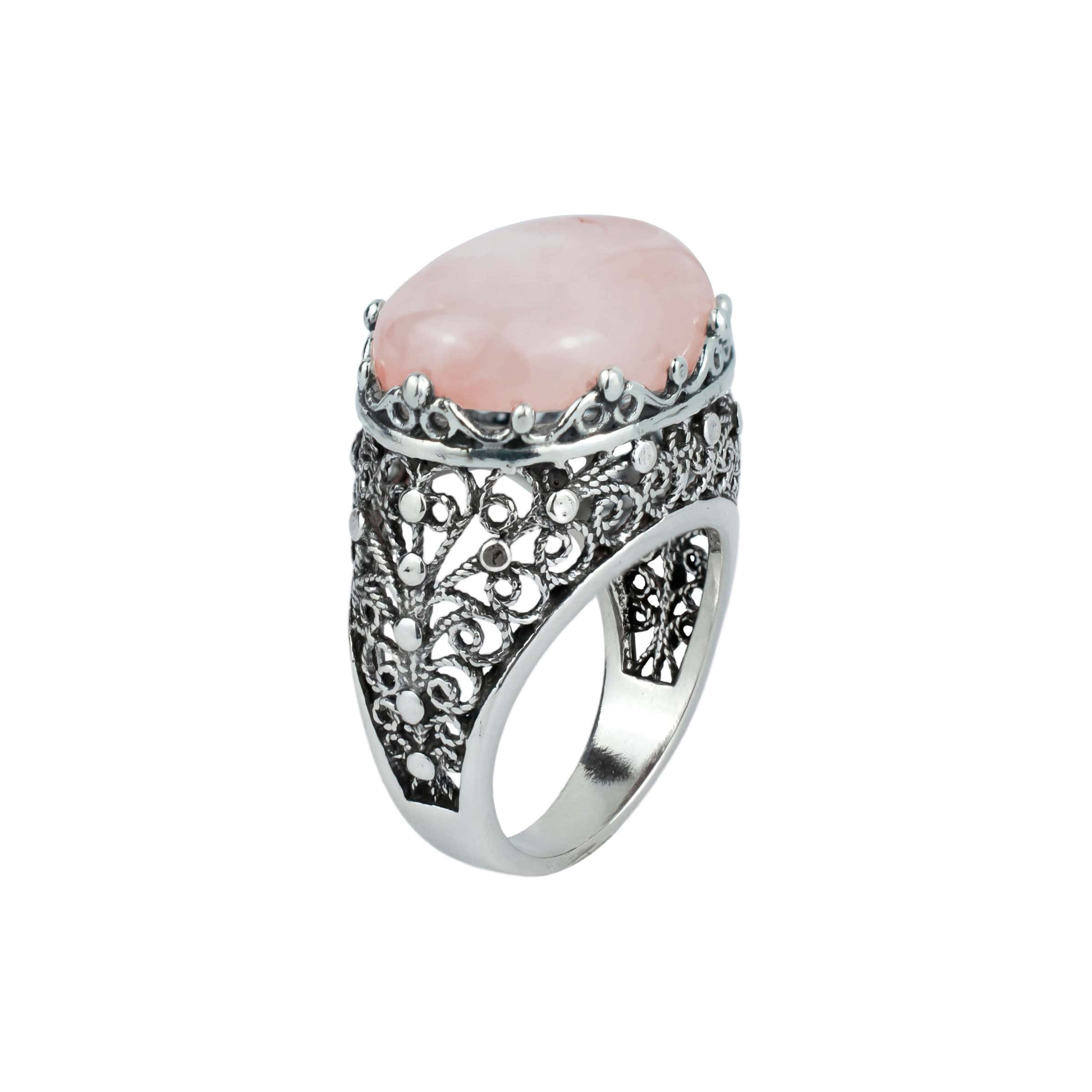 A beautifully crafted silver dome statement ring featuring a pink rose quartz gemstone set in intricate filigree art design.