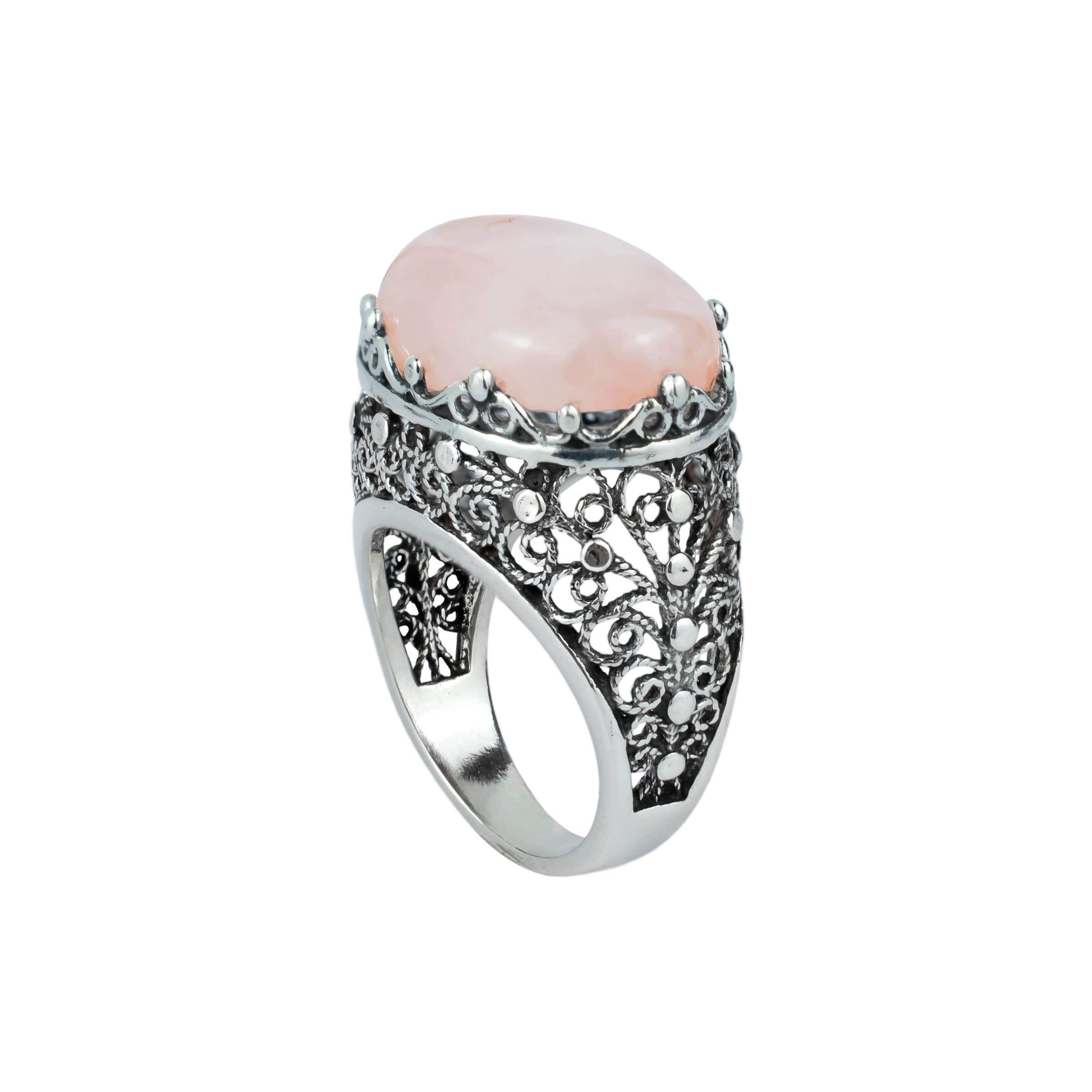 A beautifully crafted silver dome statement ring featuring a pink rose quartz gemstone set in intricate filigree art design.