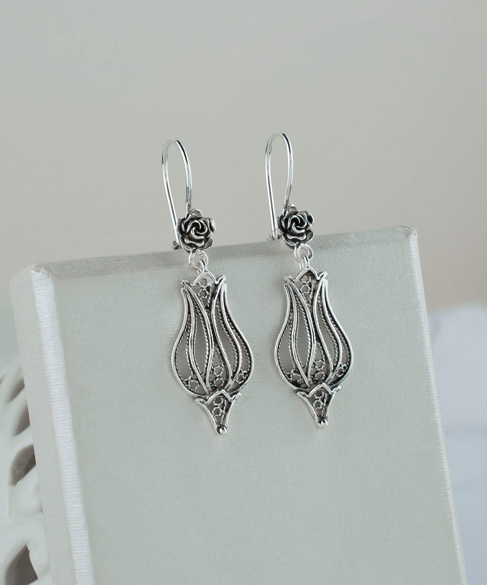 Elegant handmade sterling silver dangle drop earrings featuring a tulip design with intricate filigree detailing.