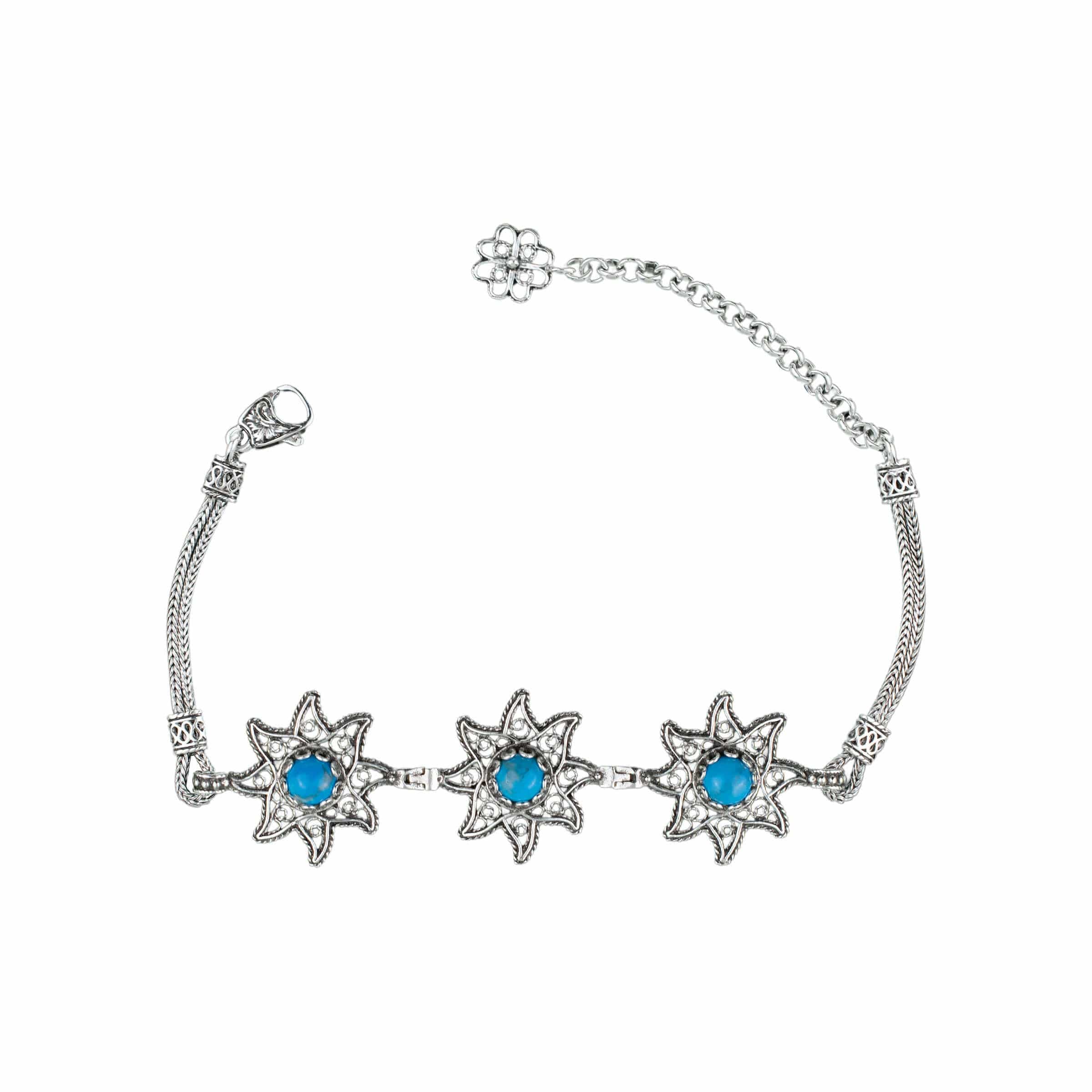 Sterling silver filigree bracelet featuring natural turquoise gemstones, showcasing intricate design and elegant craftsmanship.