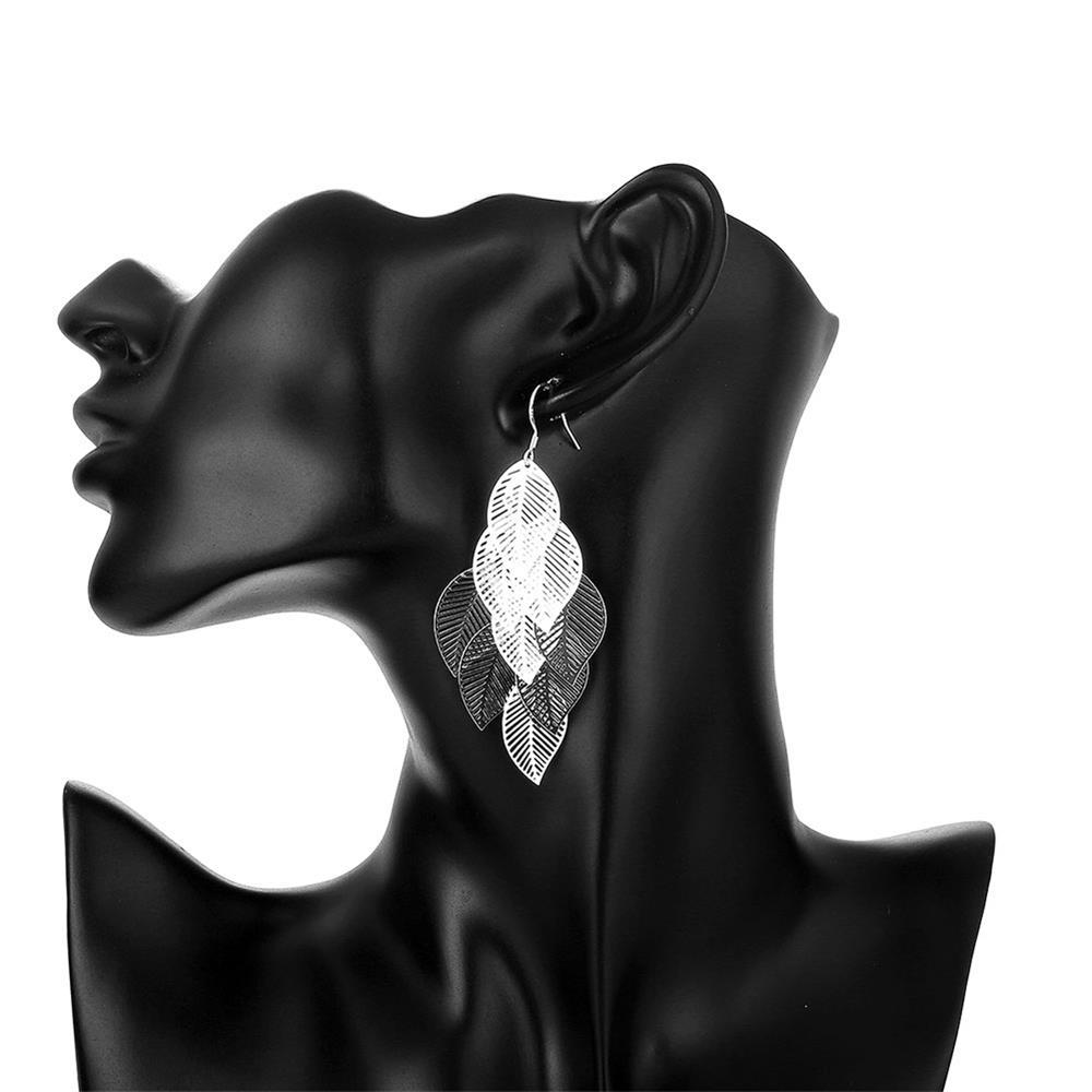 Elegant silver plated filigree dangling earrings with intricate laser cut design, measuring 7.60 cm by 1.50 cm.