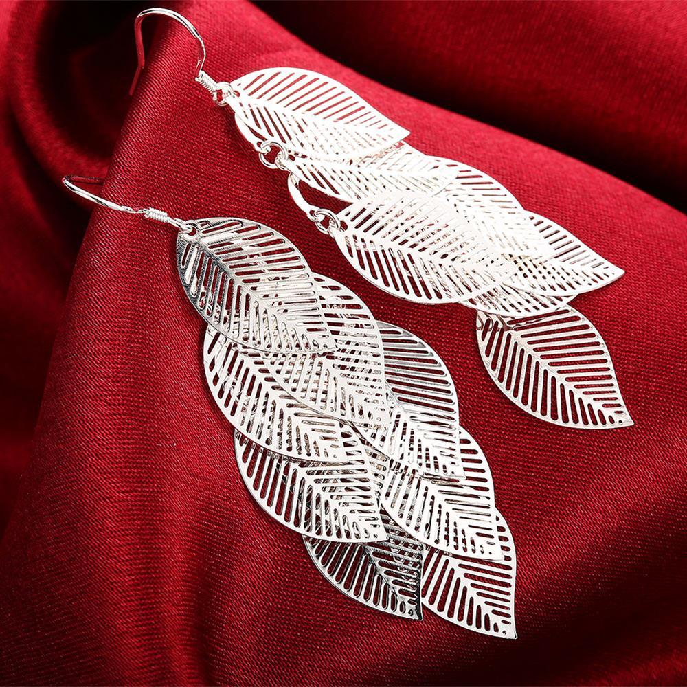 Elegant silver plated filigree dangling earrings with intricate laser cut design, perfect for fall fashion.