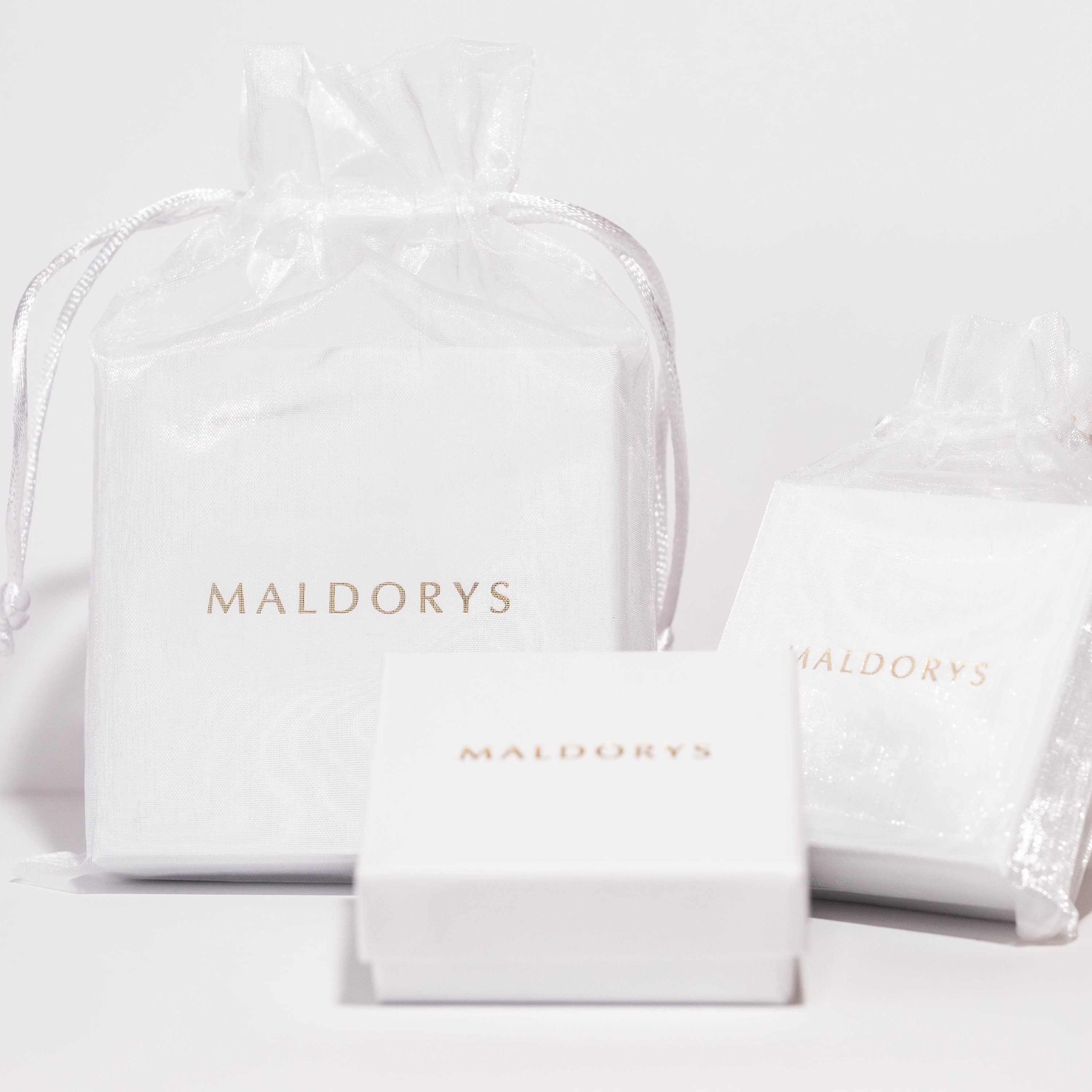 Fiorela Lapis Lazuli Round Drop Earrings in sterling silver, featuring 14 mm blue lapis lazuli stones and anti-tarnish ear wires.