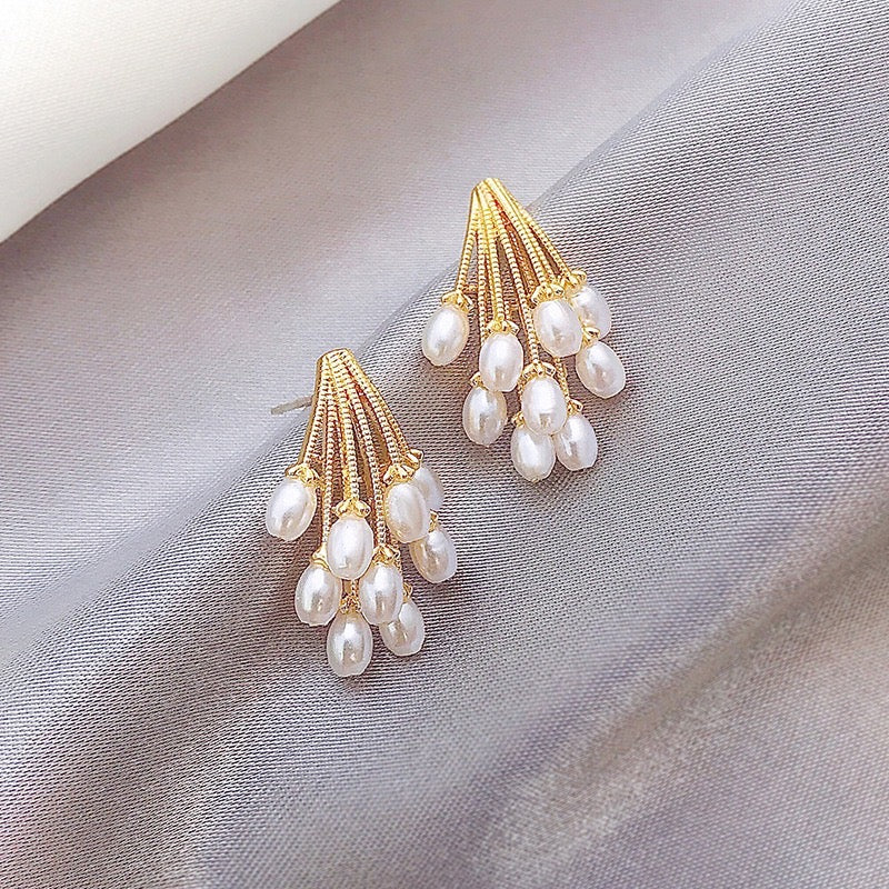 Fireworks Pearls Stud Earrings made of alloy, featuring a unique design with pearl accents, measuring 3 * 2cm.