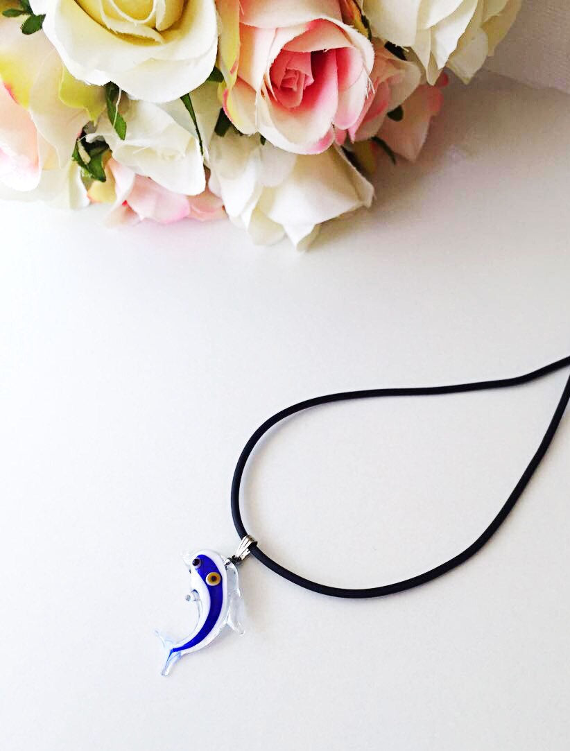 Necklace with fish pendant.